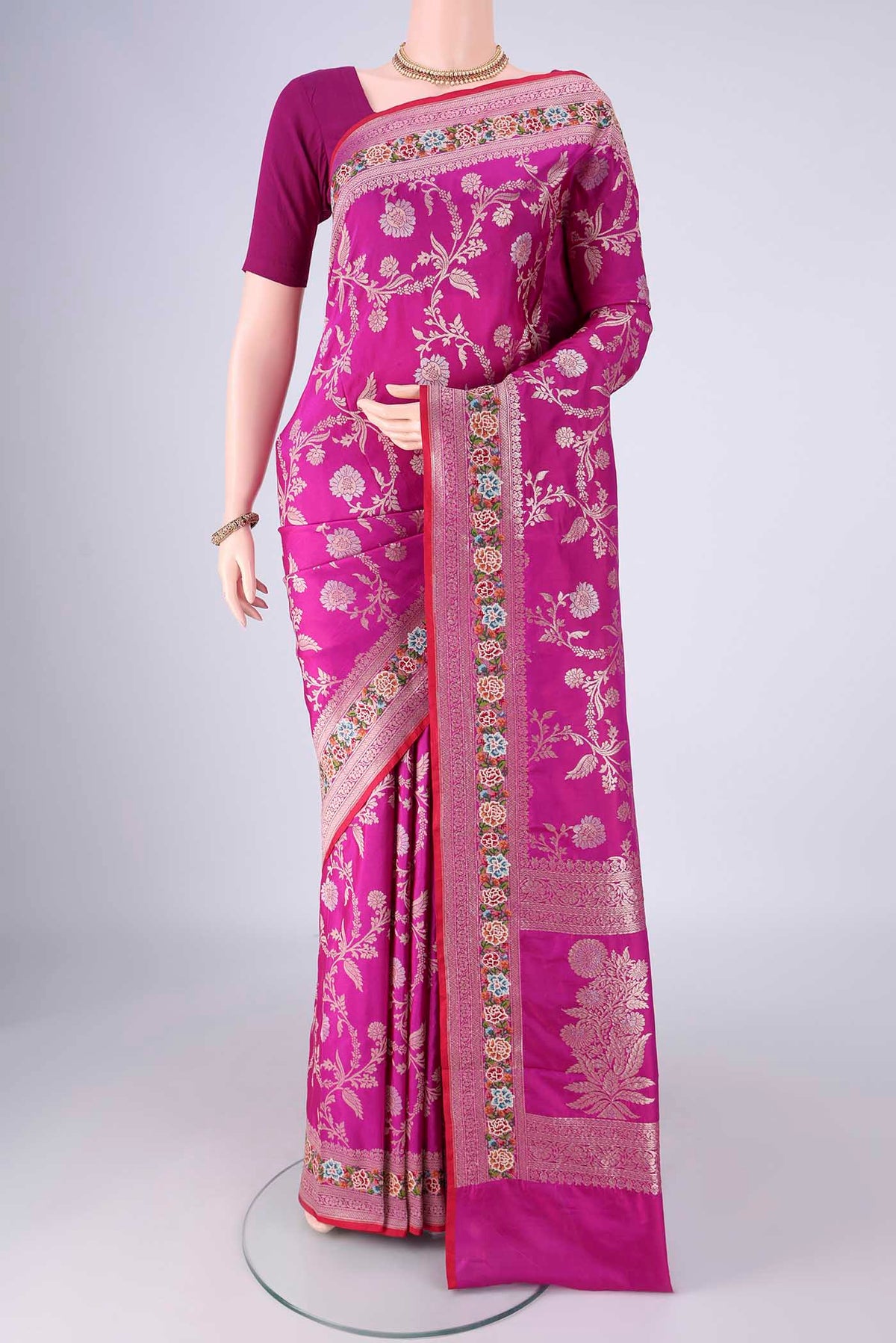 Purple Banarasi Silk Saree with Zari Butta on the body and Zari Border.  displayed on a mannequin
