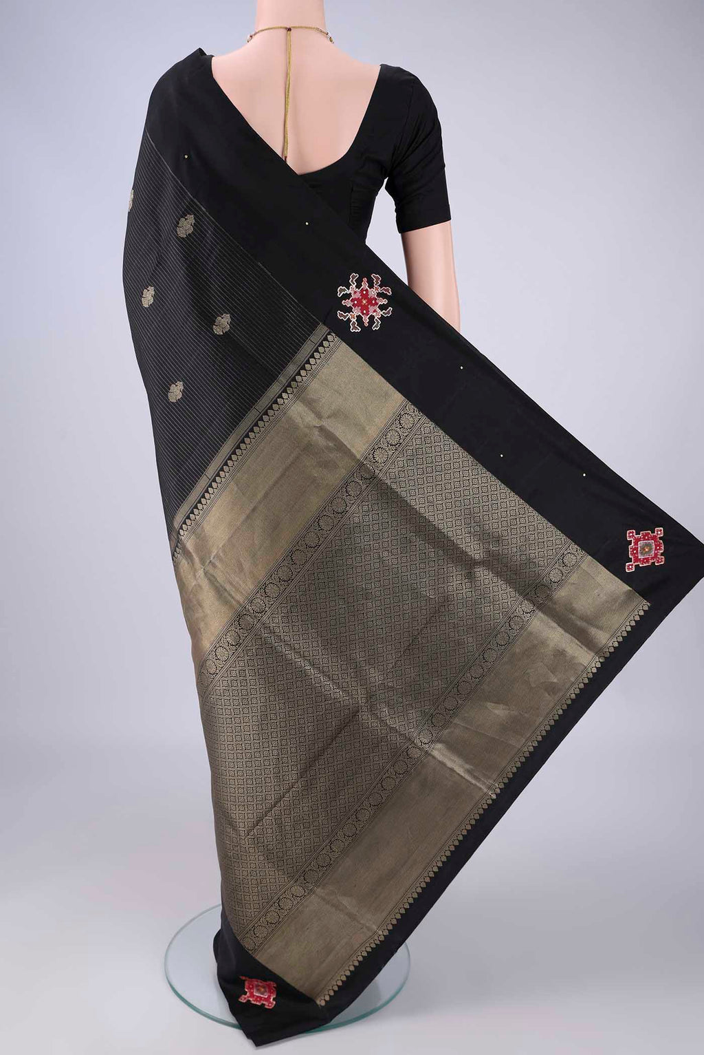 Flat view of Black Kanchipuram Silk Saree with Stripes on the body and Plain Border. 
