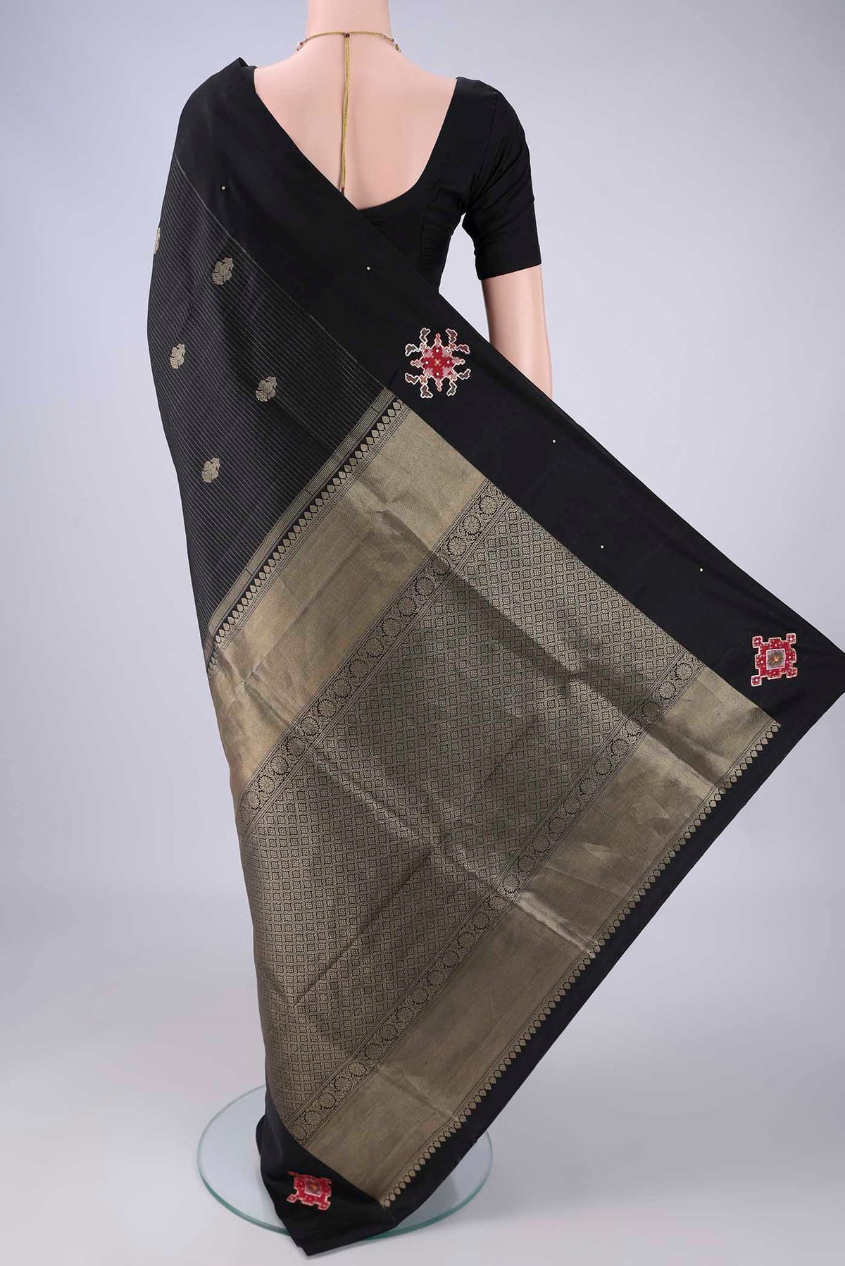Flat view of Black Kanchipuram Silk Saree with Stripes on the body and Plain Border. 