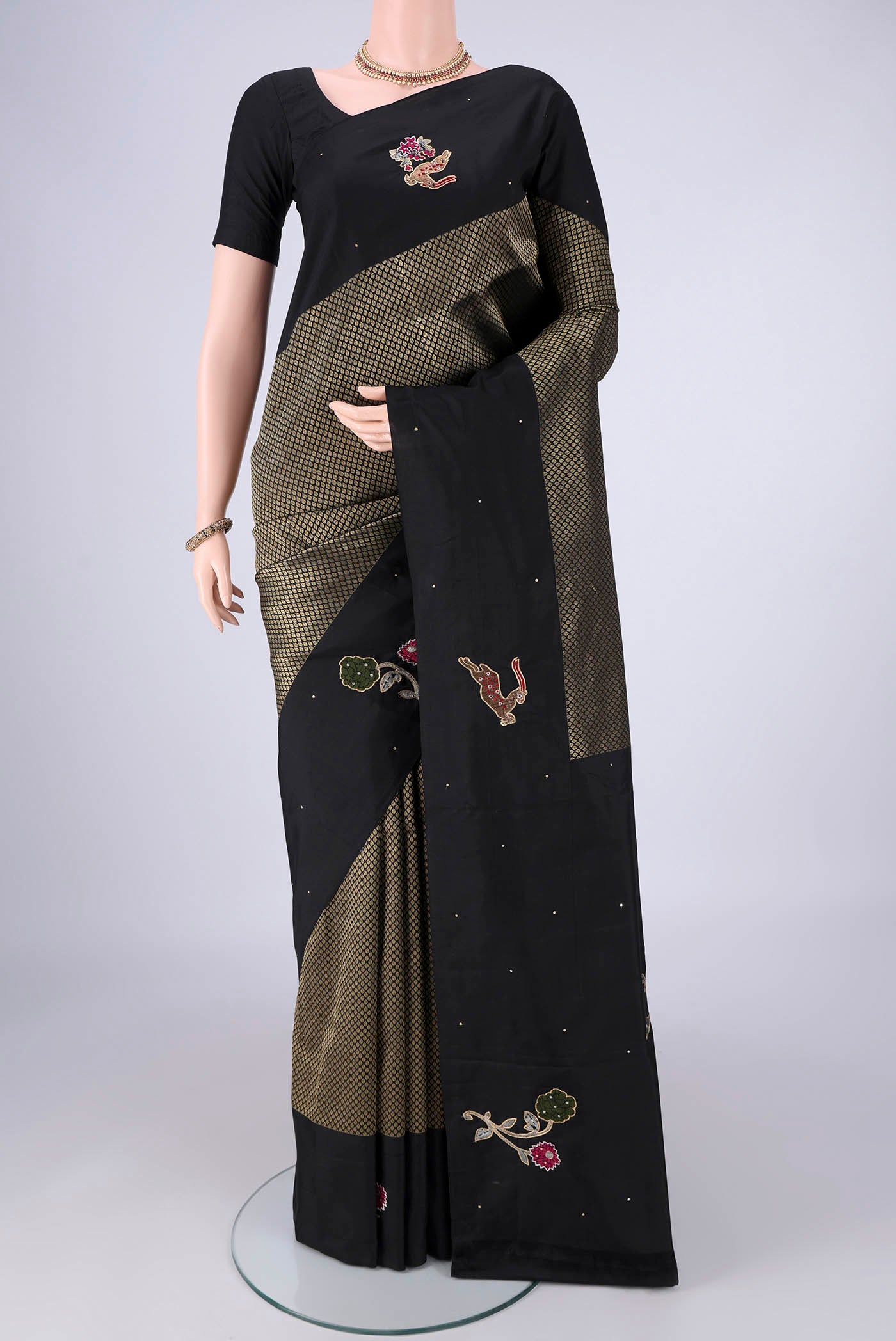 Black Kanchipuram Silk Saree with Zari Brocade on the body and Zari Border.  displayed on a mannequin