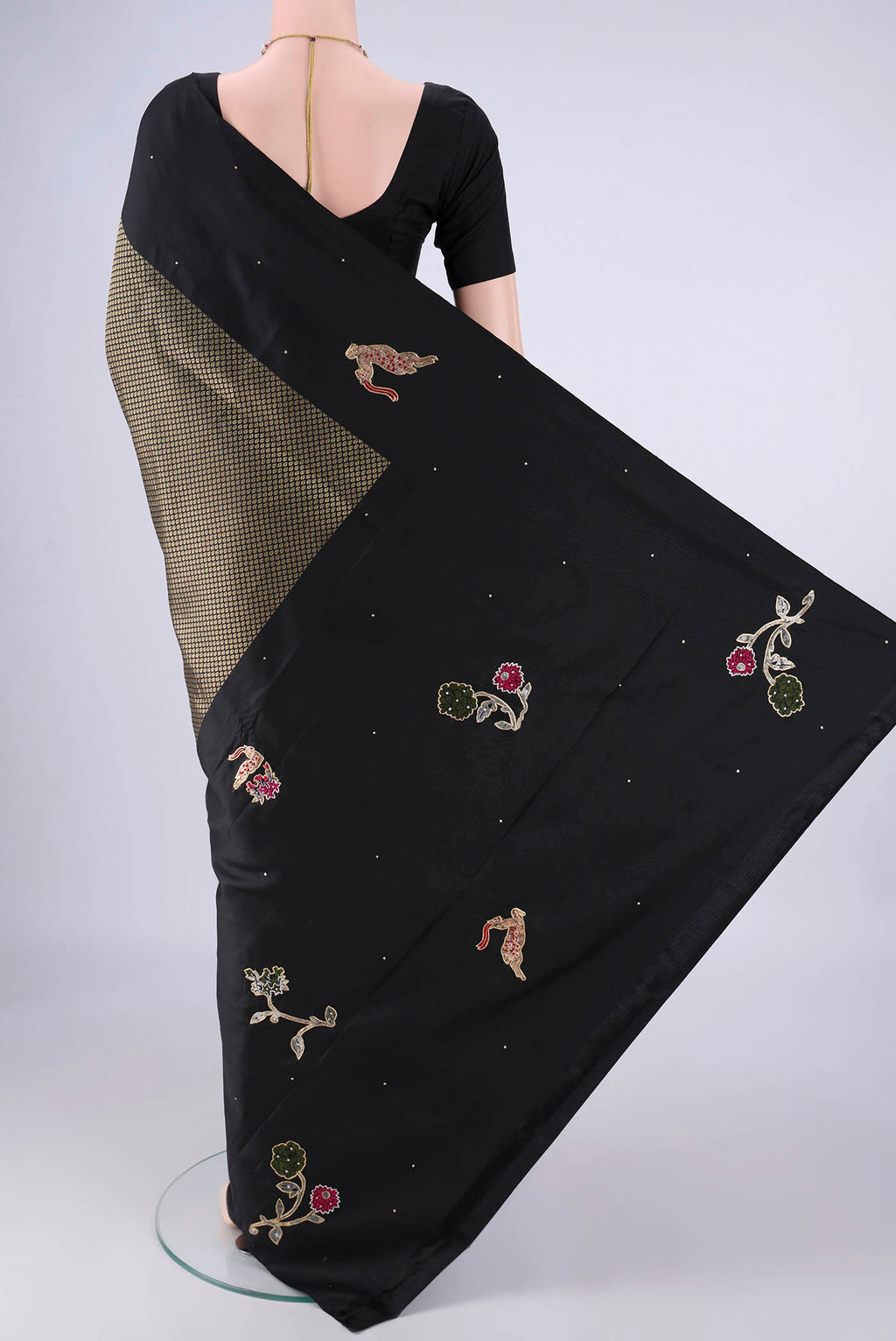 Flat view of Black Kanchipuram Silk Saree with Zari Brocade on the body and Zari Border. 