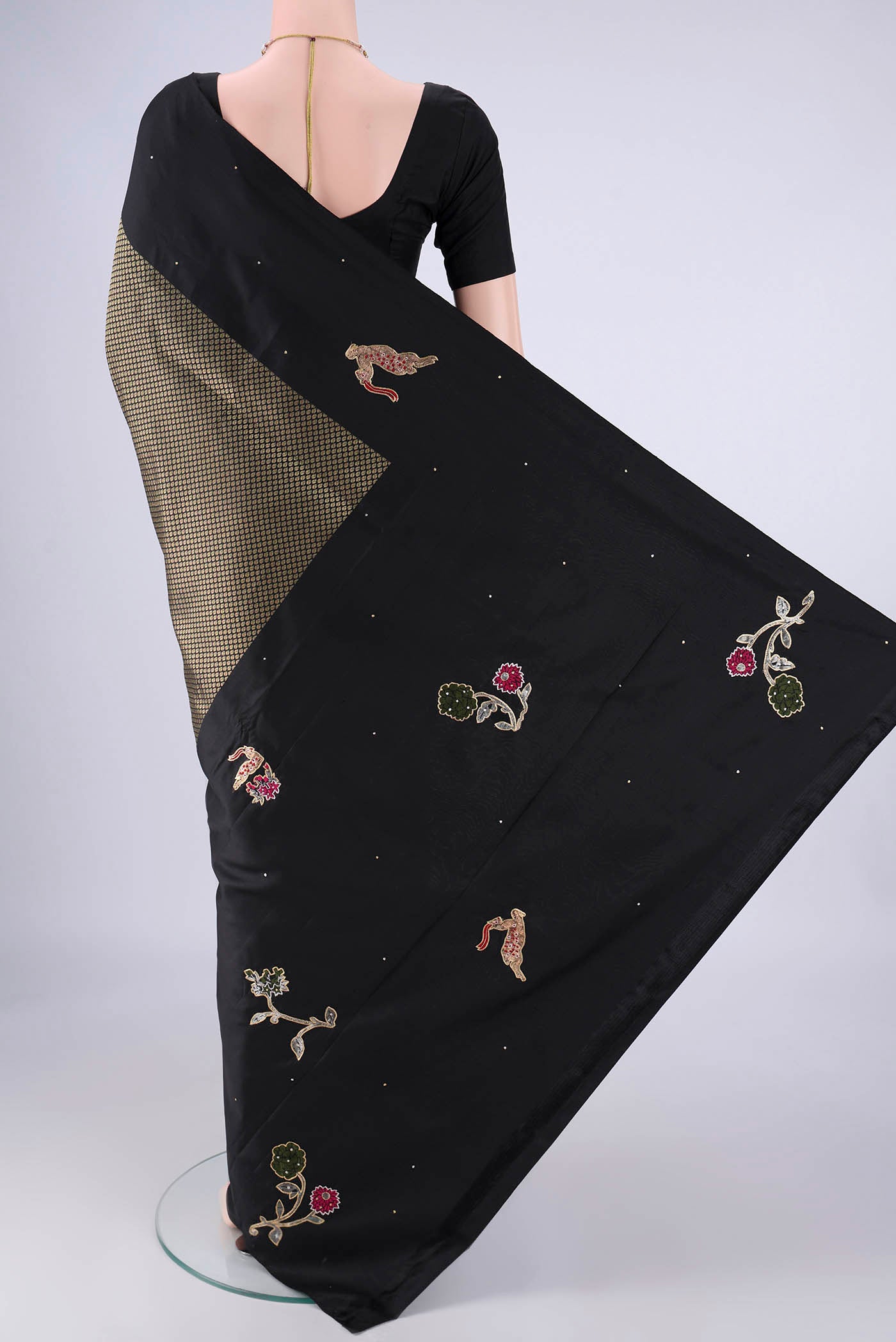 Flat view of Black Kanchipuram Silk Saree with Zari Brocade on the body and Zari Border. 