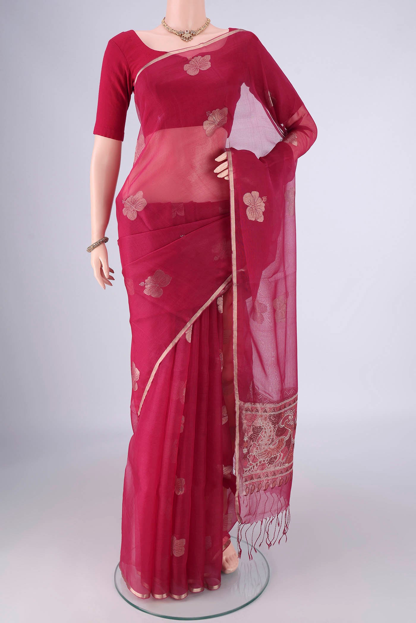 Burgundy Kanchipuram Silk Saree with Embroidery on the body and Embroidery Border.  displayed on a mannequin