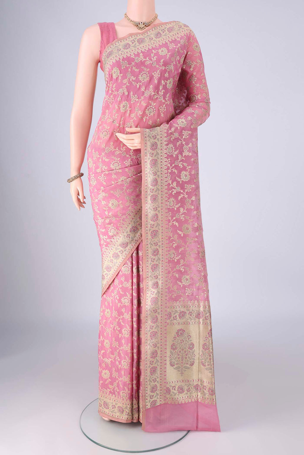 Rose pink Banarasi Silk Saree with Zari Brocade on the body and Zari Border.  displayed on a mannequin