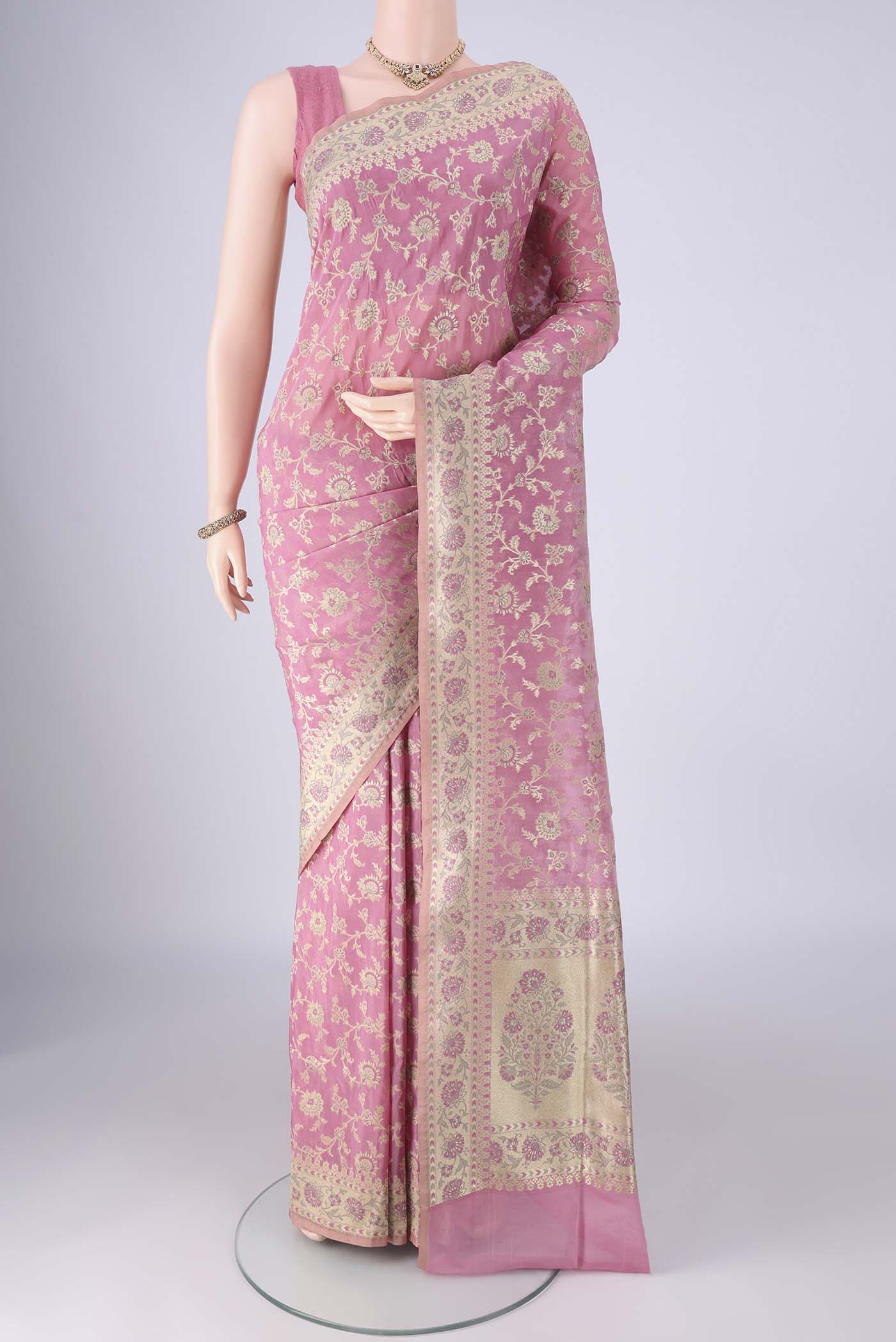 Rose pink Banarasi Silk Saree with Zari Brocade on the body and Zari Border.  displayed on a mannequin