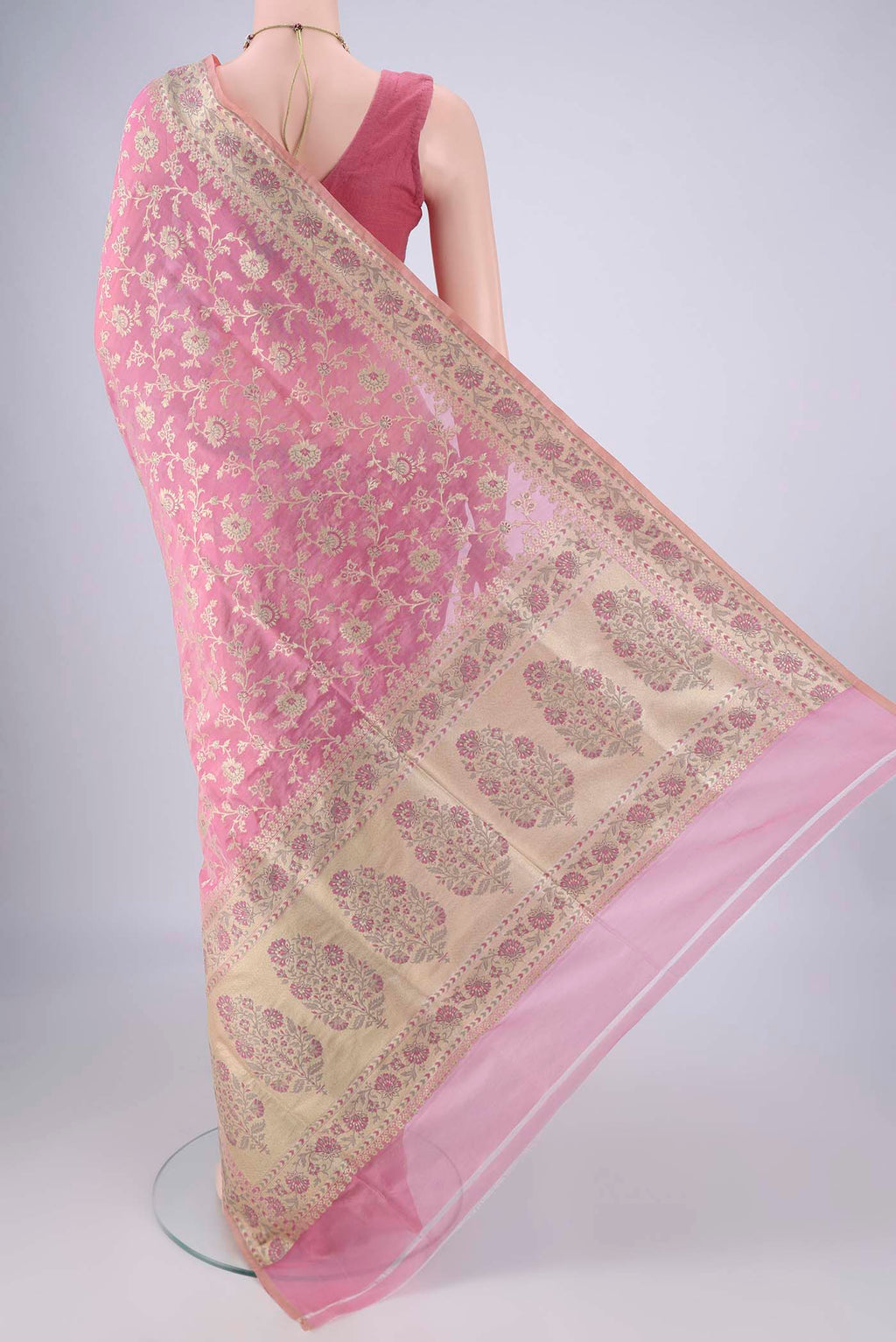 Flat view of Rose pink Banarasi Silk Saree with Zari Brocade on the body and Zari Border. 