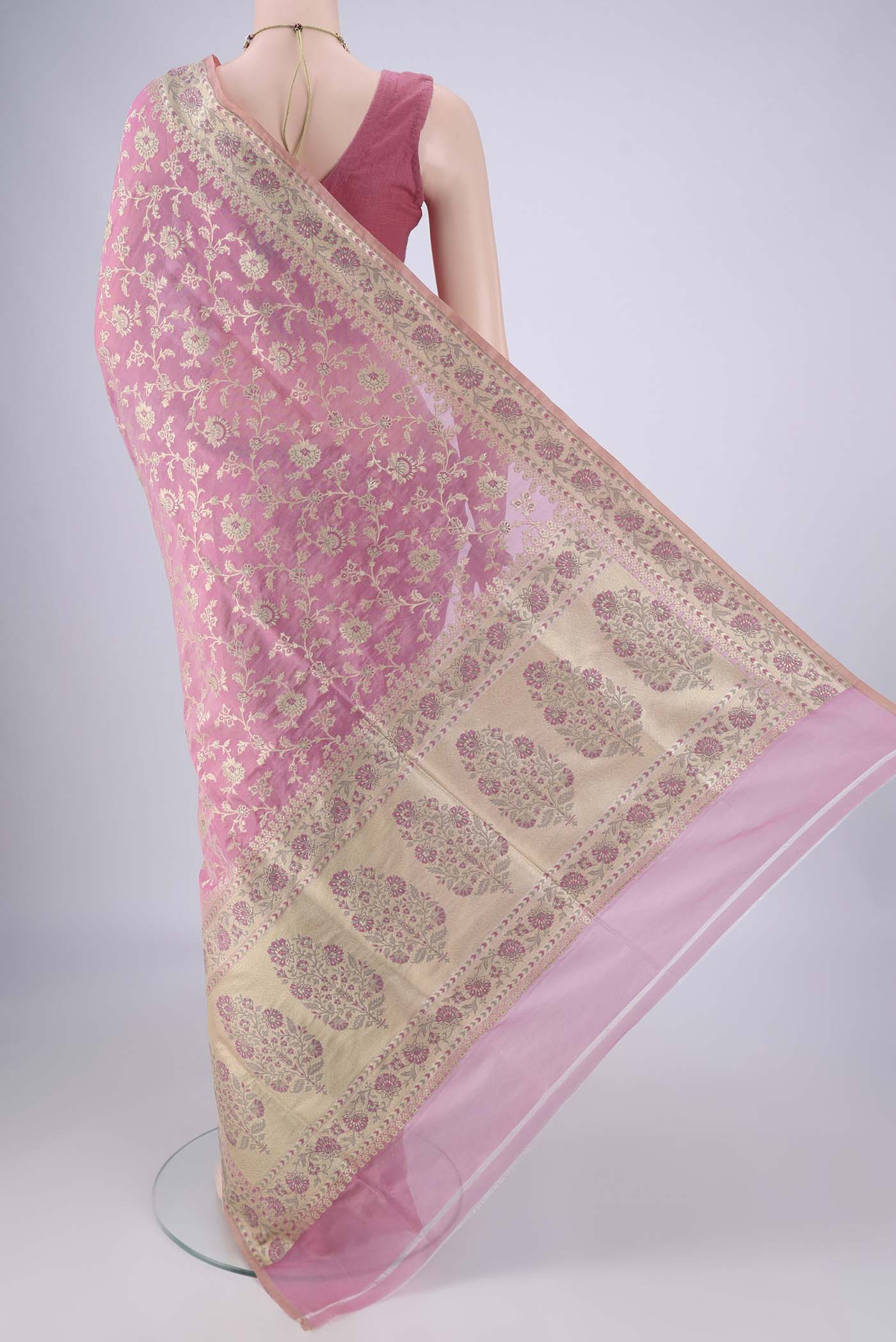 Flat view of Rose pink Banarasi Silk Saree with Zari Brocade on the body and Zari Border. 