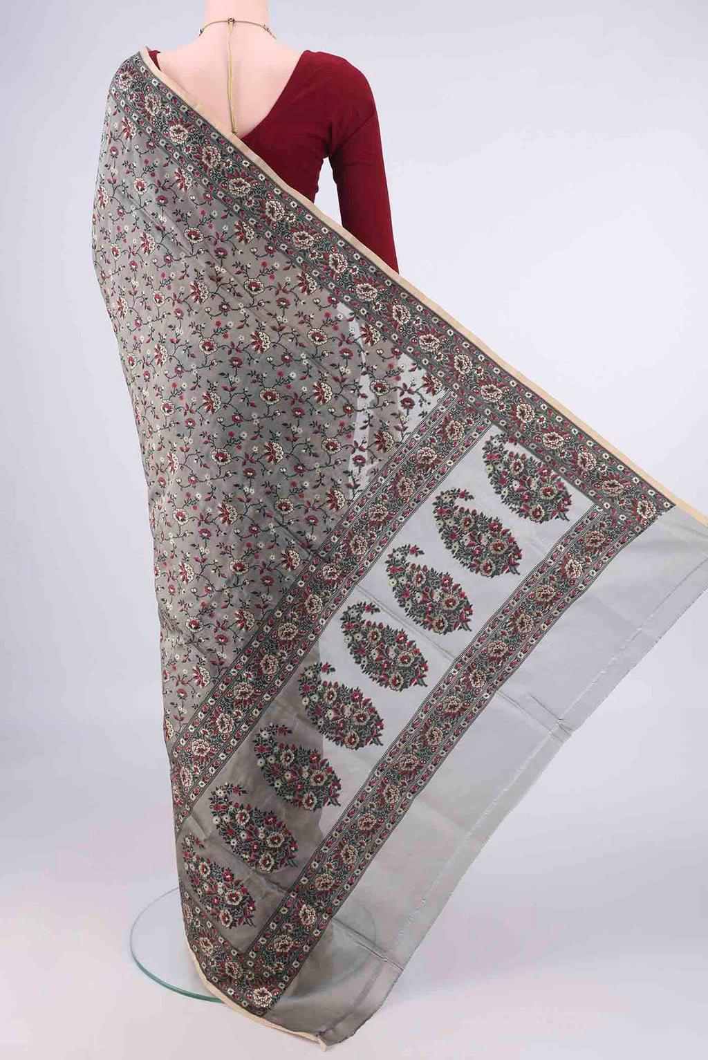 Flat view of Pure Silk Davys Grey Banarasi Saree with Zari And Thread Butta on the body and Zari Border. 