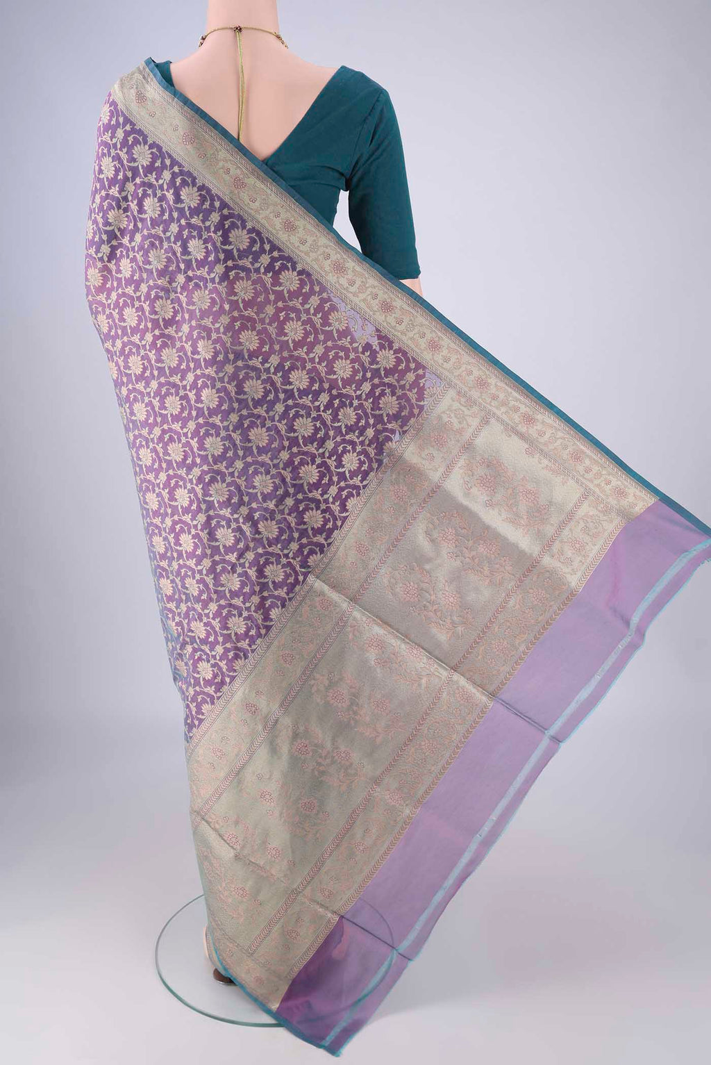Flat view of Purple Banarasi Silk Saree with Zari Brocade on the body and Zari Border. 