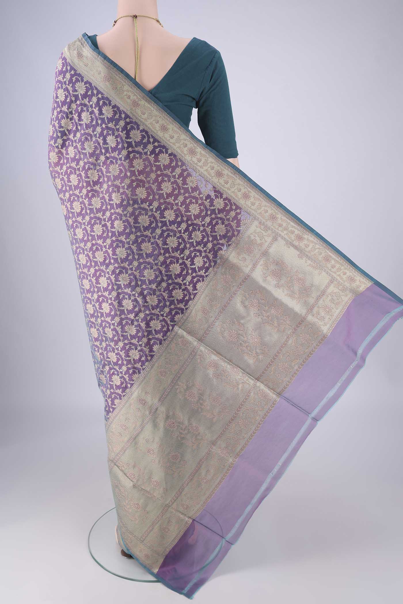 Flat view of Purple Banarasi Silk Saree with Zari Brocade on the body and Zari Border. 