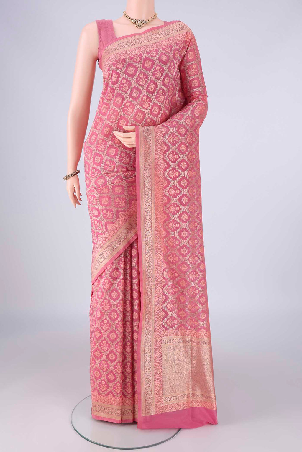 Rose pink Banarasi Silk Saree with Zari Brocade on the body and Zari Border.  displayed on a mannequin