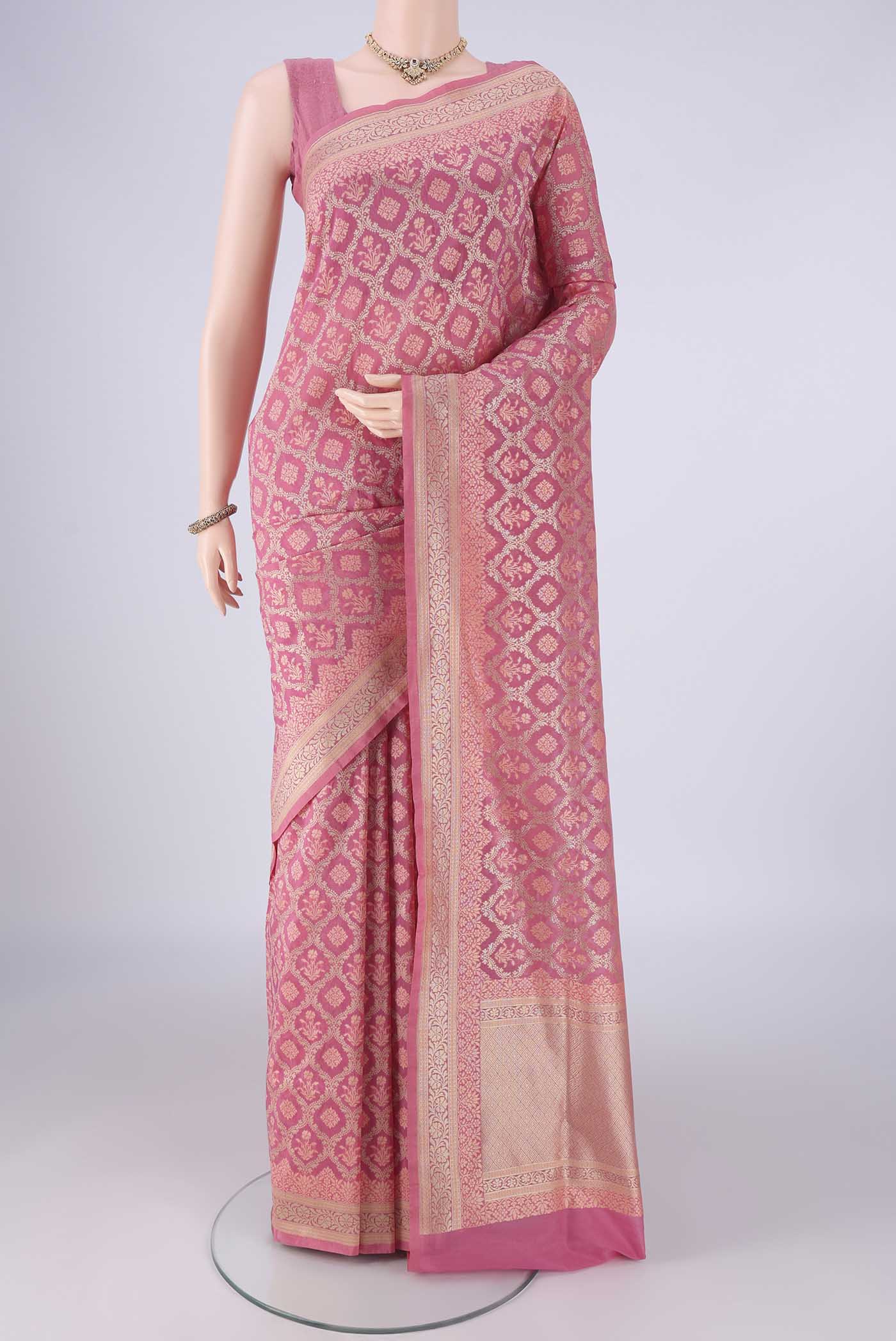 Rose pink Banarasi Silk Saree with Zari Brocade on the body and Zari Border.  displayed on a mannequin