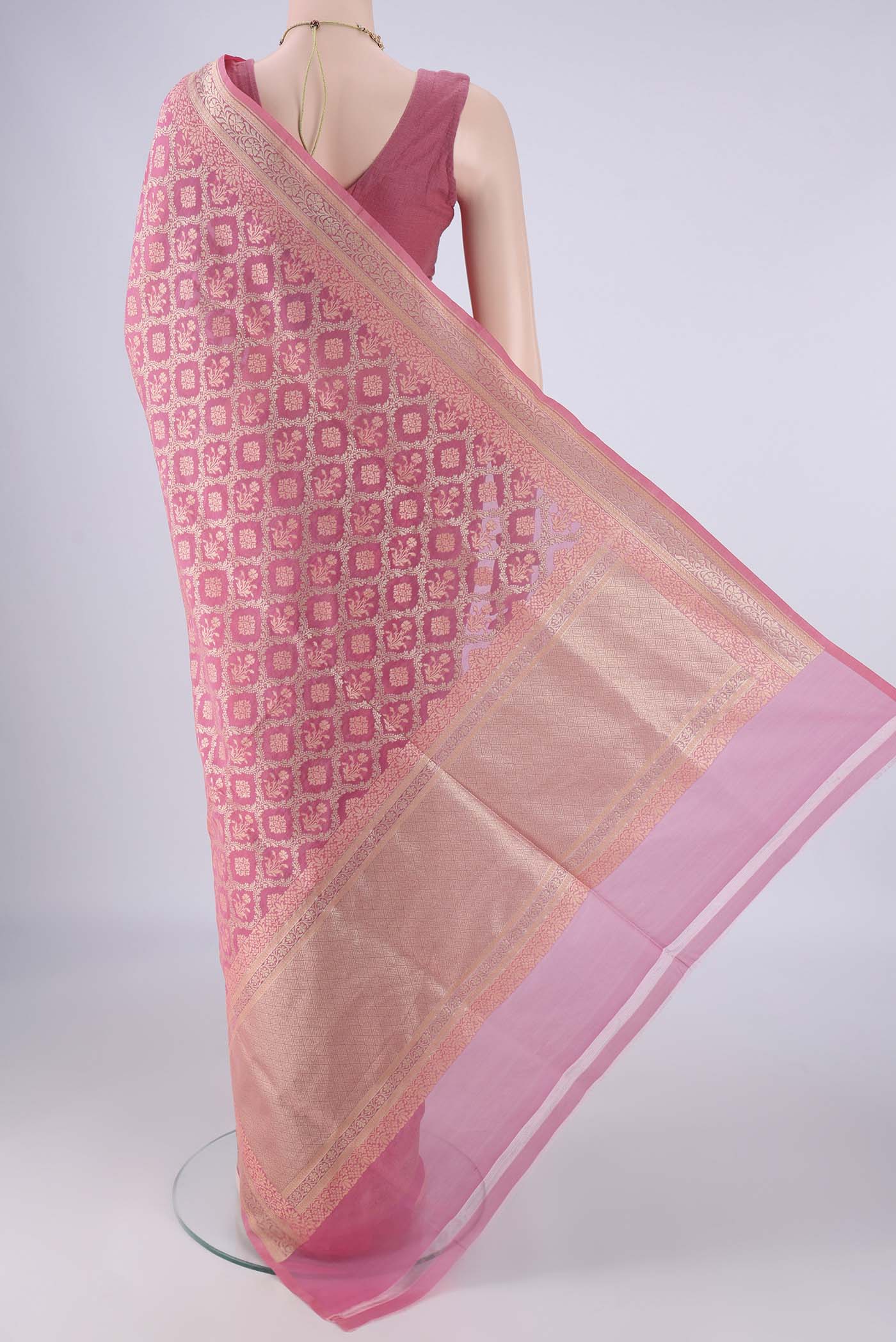 Flat view of Rose pink Banarasi Silk Saree with Zari Brocade on the body and Zari Border. 