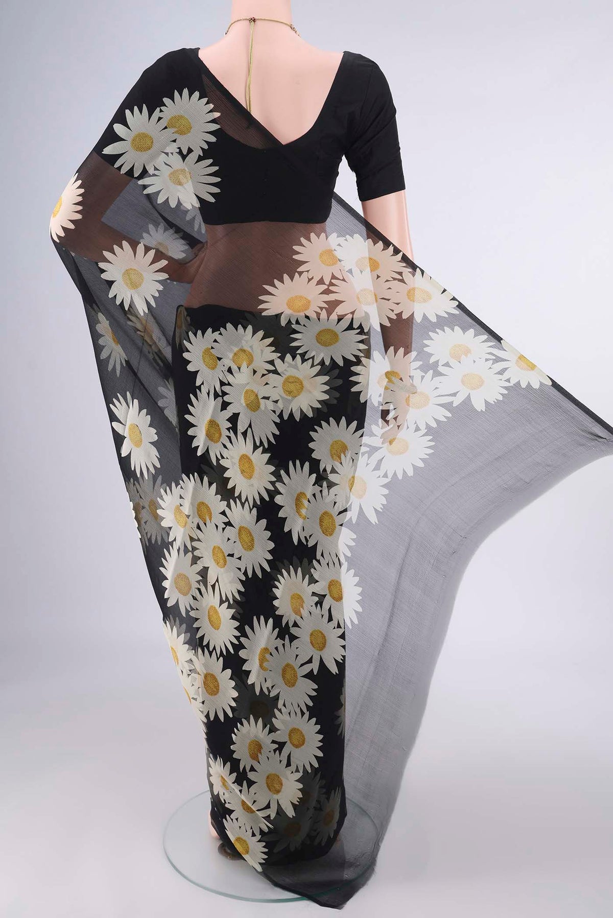 Flat view of Black Mysore Chiffon Saree with Printed design on the body and Without Border. 