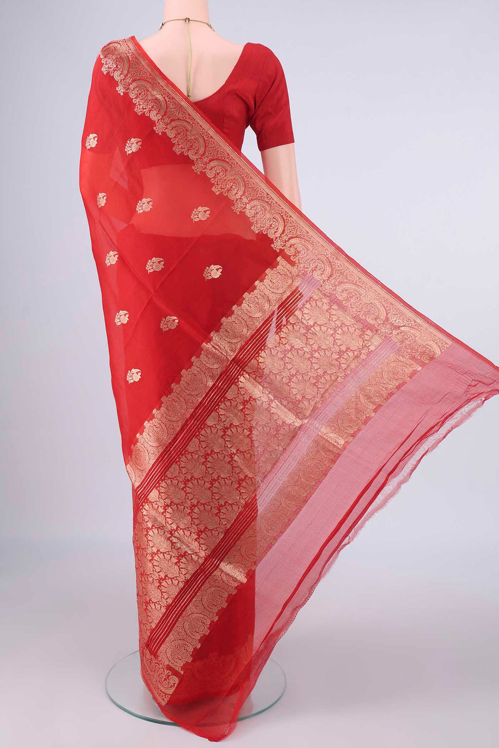 Flat view of Red Banarasi Georgette Saree with Zari Butta on the body and Zari Border. 