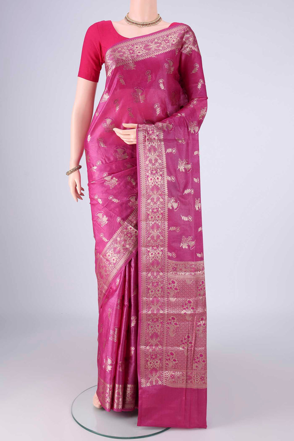 Light Magenta Banarasi Tussar Silk Saree with Zari And Thread Butta on the body and Zari Border.  displayed on a mannequin
