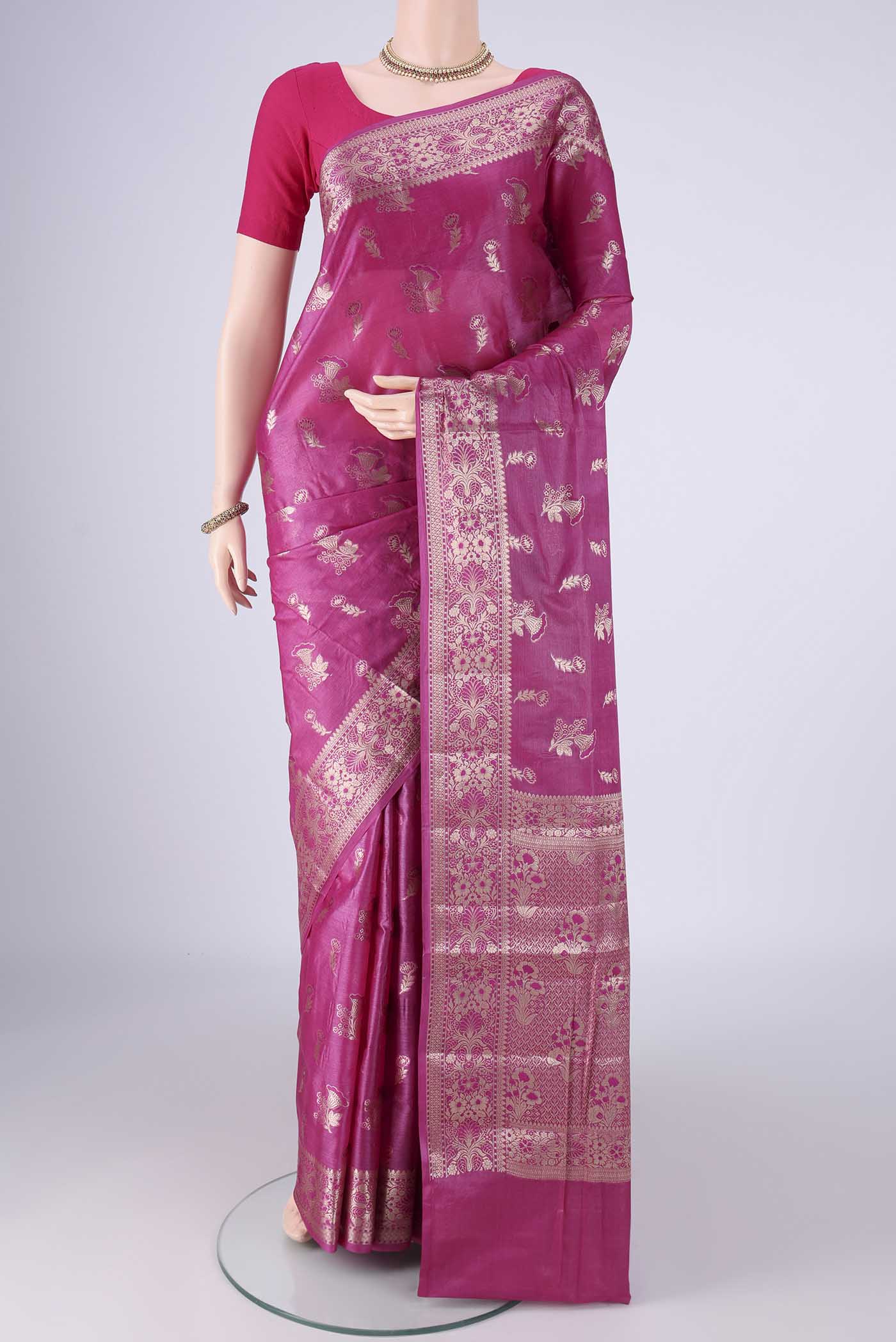 Light Magenta Banarasi Tussar Silk Saree with Zari And Thread Butta on the body and Zari Border.  displayed on a mannequin