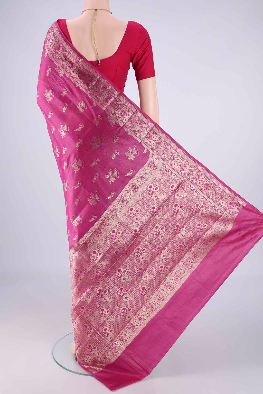 Flat view of Light Magenta Banarasi Tussar Silk Saree with Zari And Thread Butta on the body and Zari Border. 
