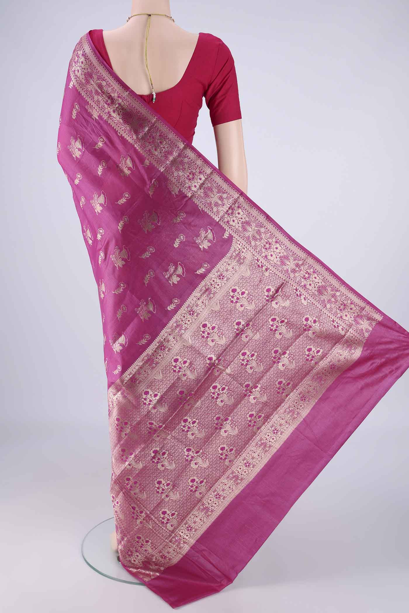 Flat view of Light Magenta Banarasi Tussar Silk Saree with Zari And Thread Butta on the body and Zari Border. 