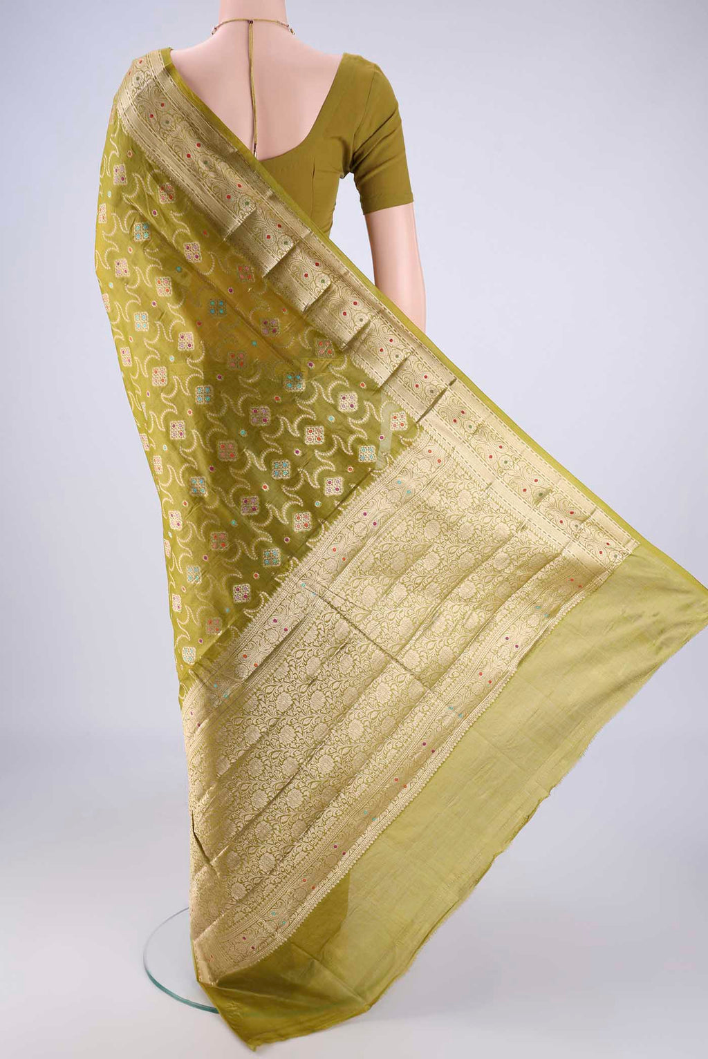 Flat view of Light Green Banarasi Tussar Silk Saree with Zari And Thread Butta on the body and Zari Border. 