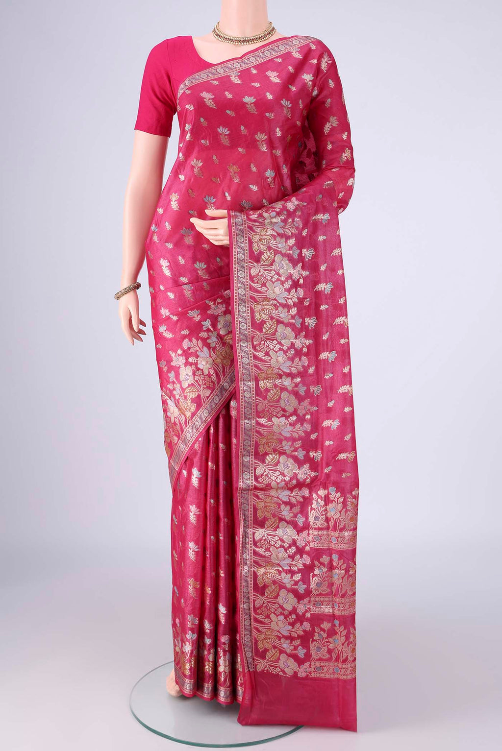 Rani Pink Banarasi Tussar Silk Saree with Zari And Thread Butta on the body and Zari Border.  displayed on a mannequin