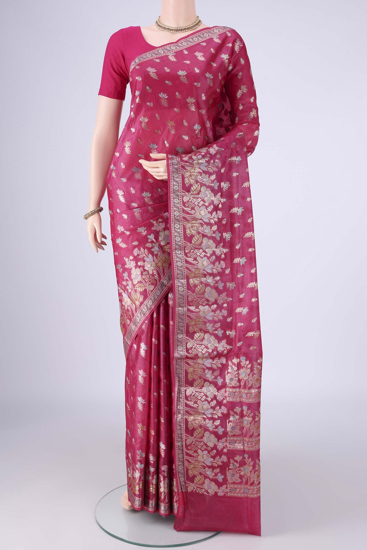 Rani Pink Banarasi Tussar Silk Saree with Zari And Thread Butta on the body and Zari Border.  displayed on a mannequin