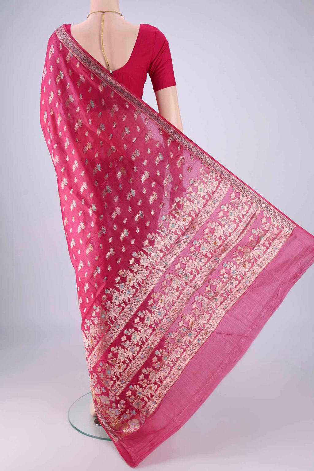 Flat view of Rani Pink Banarasi Tussar Silk Saree with Zari And Thread Butta on the body and Zari Border. 