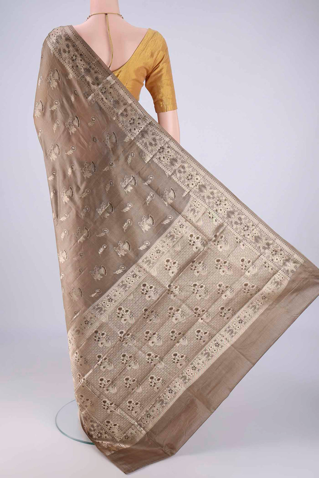 Flat view of Dark Beige Banarasi Tussar Silk Saree with Zari And Thread Butta on the body and Zari Border. 