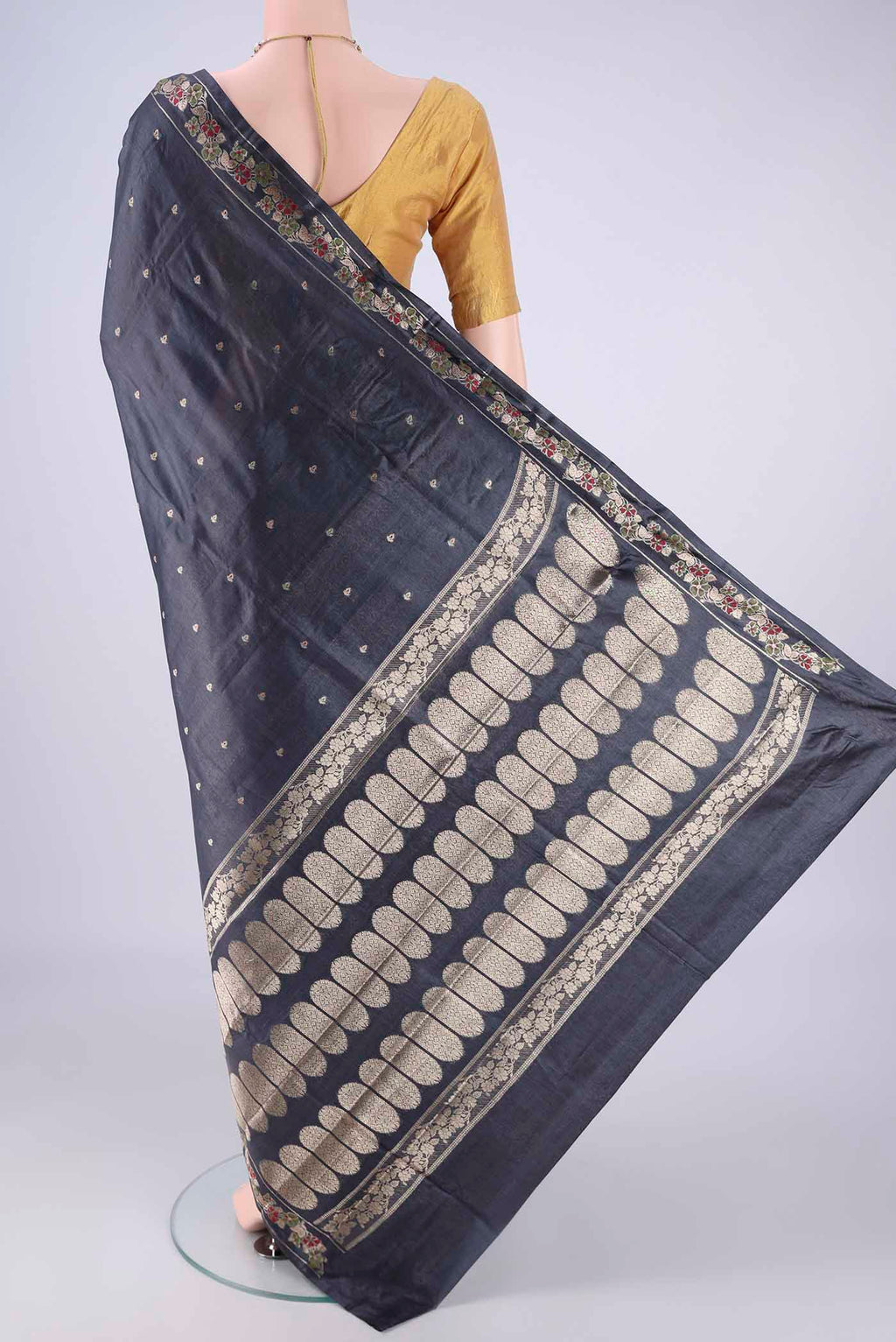 Flat view of Davys Grey Banarasi Tussar Silk Saree with Zari And Thread Butta on the body and Zari Border. 