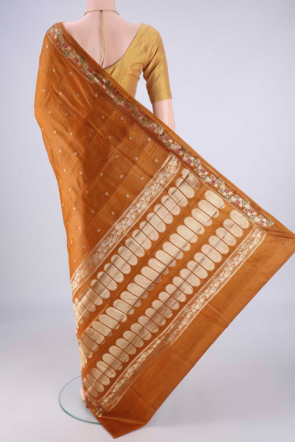 Flat view of Mustard Banarasi Tussar Silk Saree with Zari And Thread Butta on the body and Zari Border. 