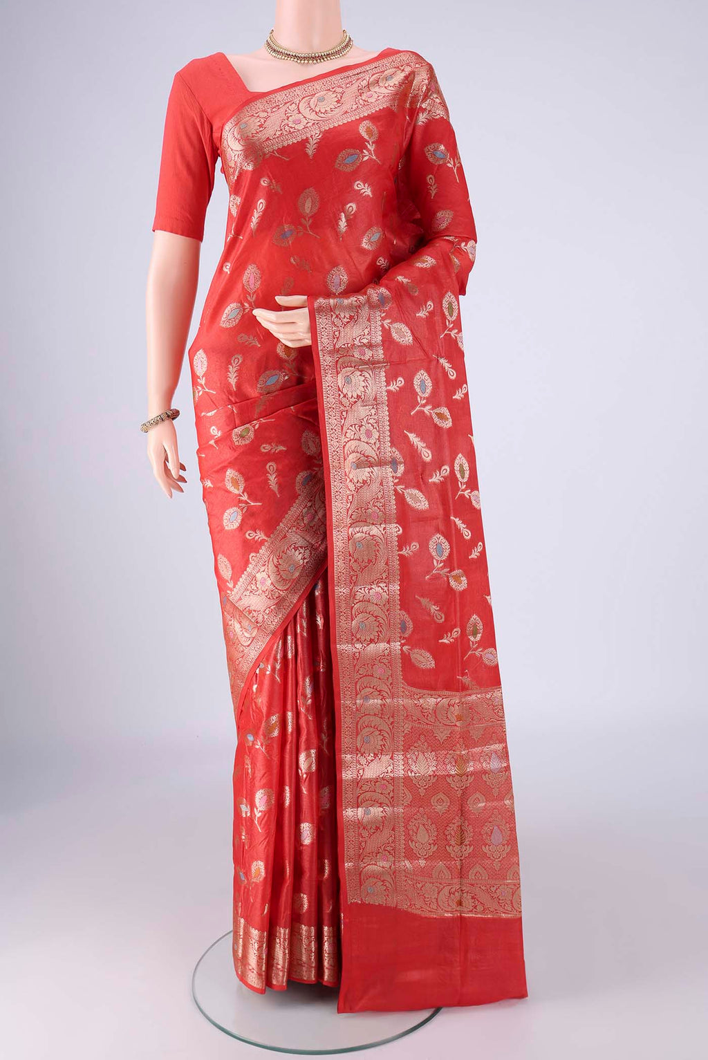 Red Banarasi Tussar Silk Saree with Zari And Thread Butta on the body and Zari Border.  displayed on a mannequin