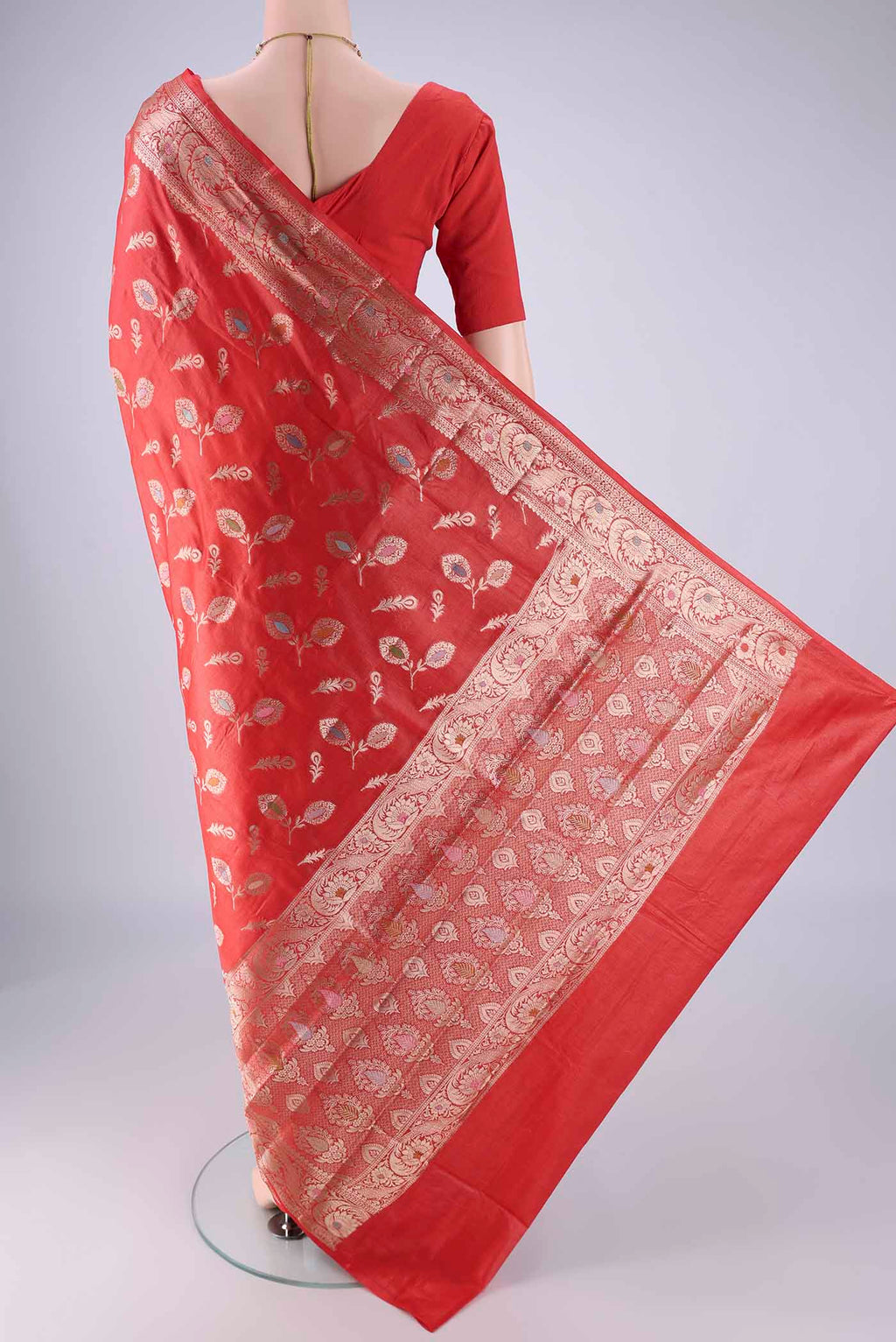 Flat view of Red Banarasi Tussar Silk Saree with Zari And Thread Butta on the body and Zari Border. 