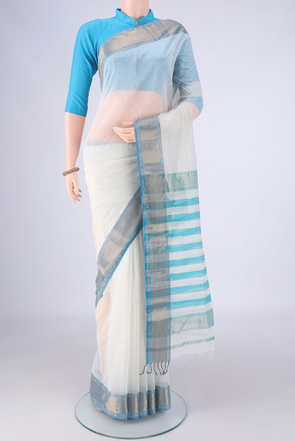 White Maheshwari Silk Cotton Saree with Plain Body and Zari Border.  displayed on a mannequin