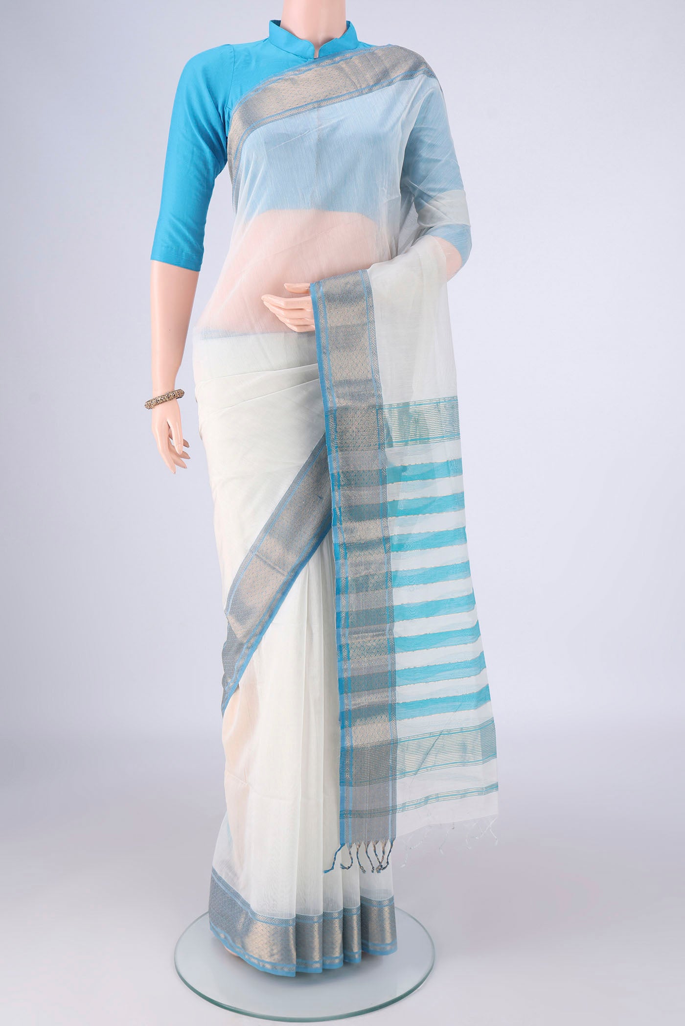 White Maheshwari Silk Cotton Saree with Plain Body and Zari Border.  displayed on a mannequin