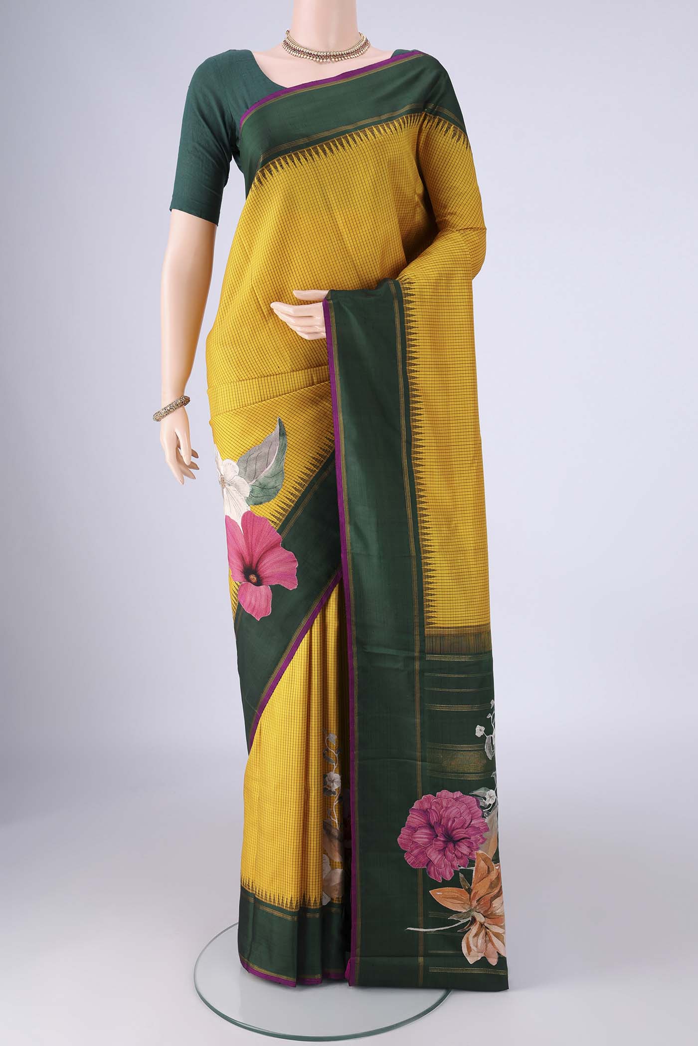 Mustard Kanchipuram Silk Saree with Checked design on the body and Plain Border.  displayed on a mannequin
