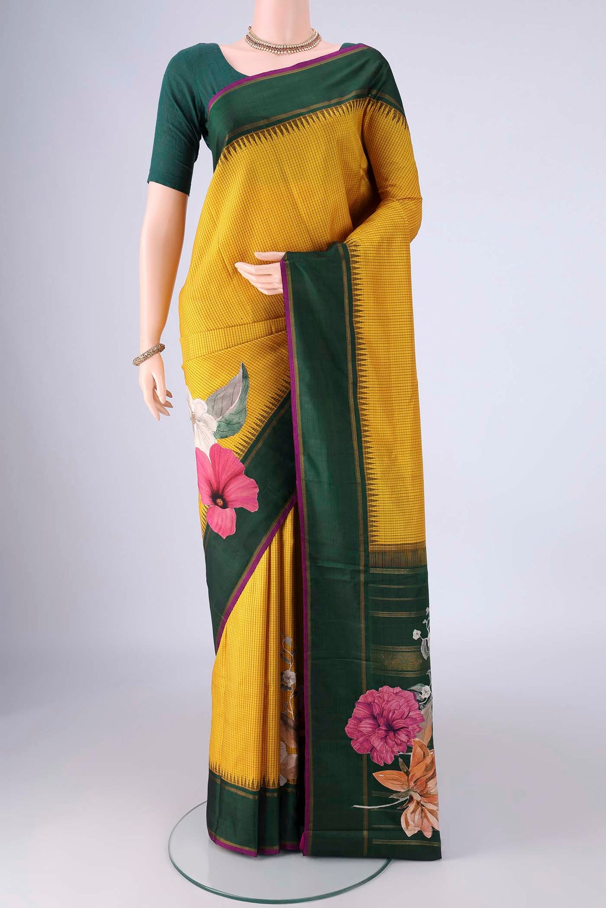 Mustard Kanchipuram Silk Saree with Checked design on the body and Plain Border.  displayed on a mannequin
