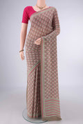 Beige Mysore Crepe Saree with Printed design on the body and Printed Border.  displayed on a mannequin