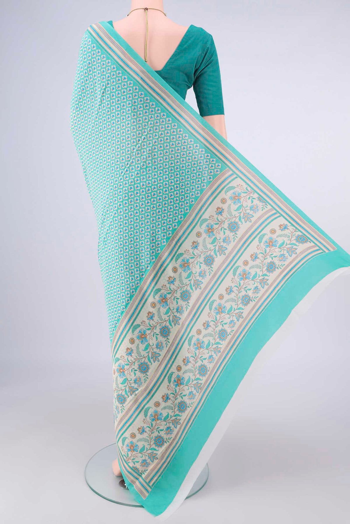 Flat view of Turquoise Mysore Crepe Saree with Floral Print on the body and Plain Border. 