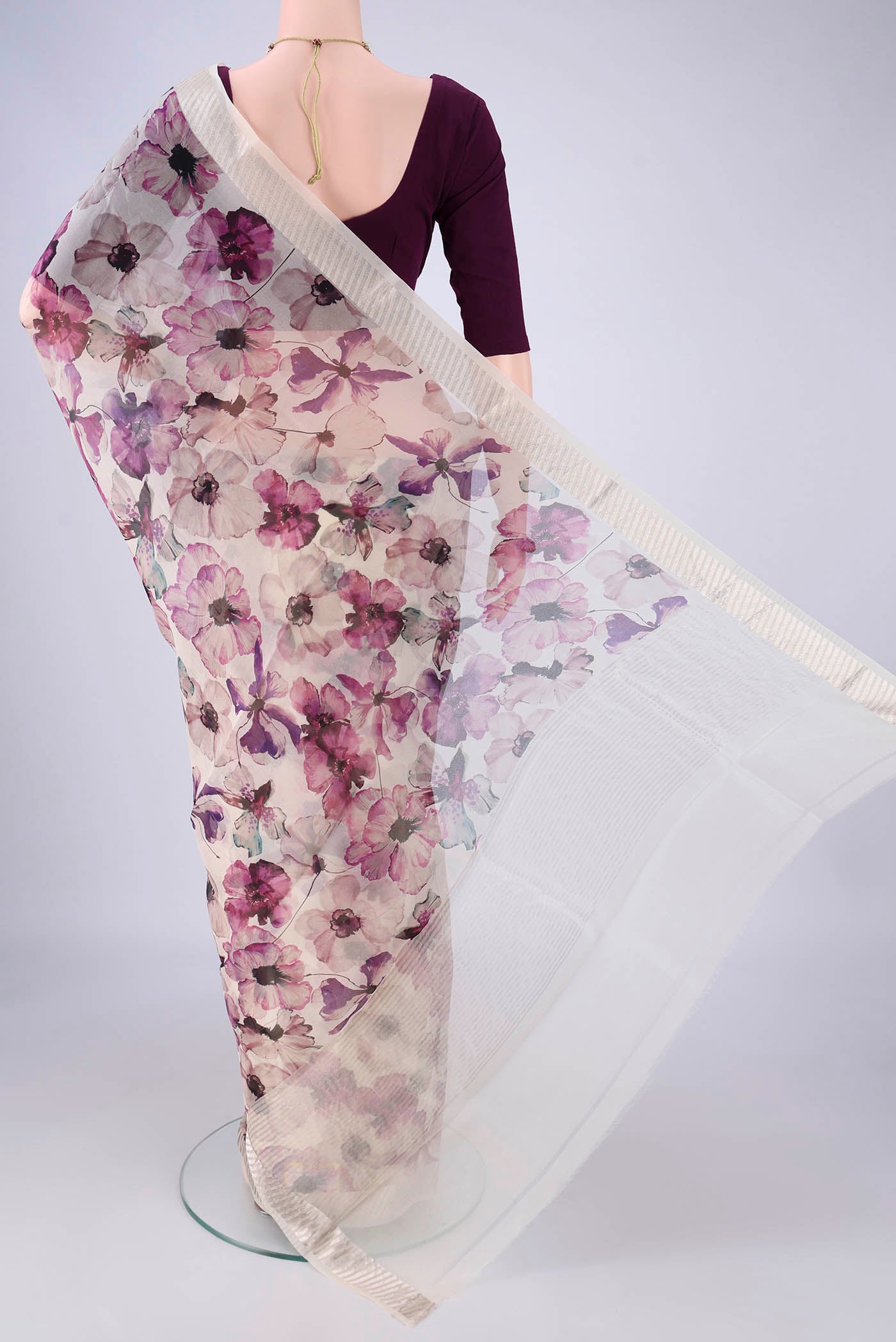 Flat view of Off White Organza Silk Saree with Printed design on the body and Zari Border. 