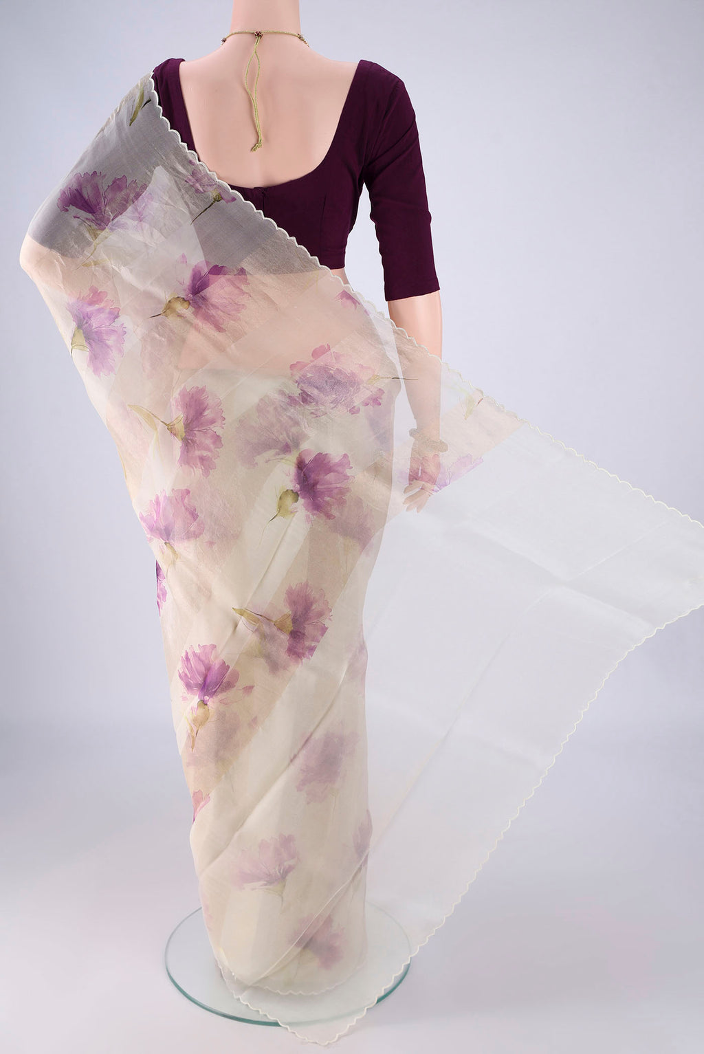 Flat view of Off White Organza Silk Saree with Printed design on the body and Fancy Border. 