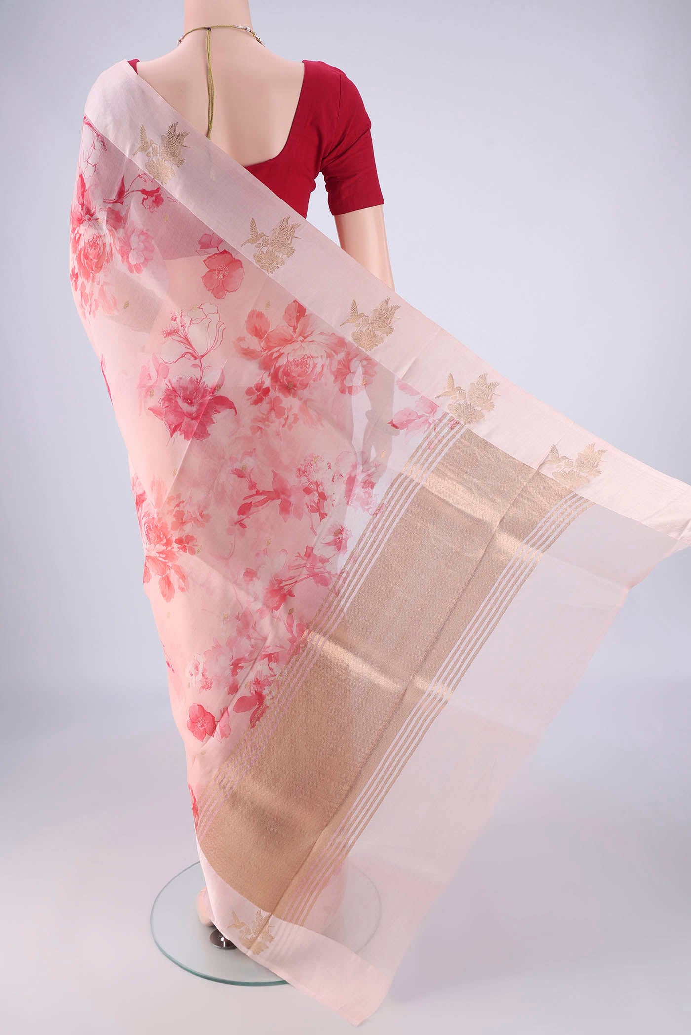 Flat view of Pink Organza Silk Saree with Printed design on the body and Zari Border. 
