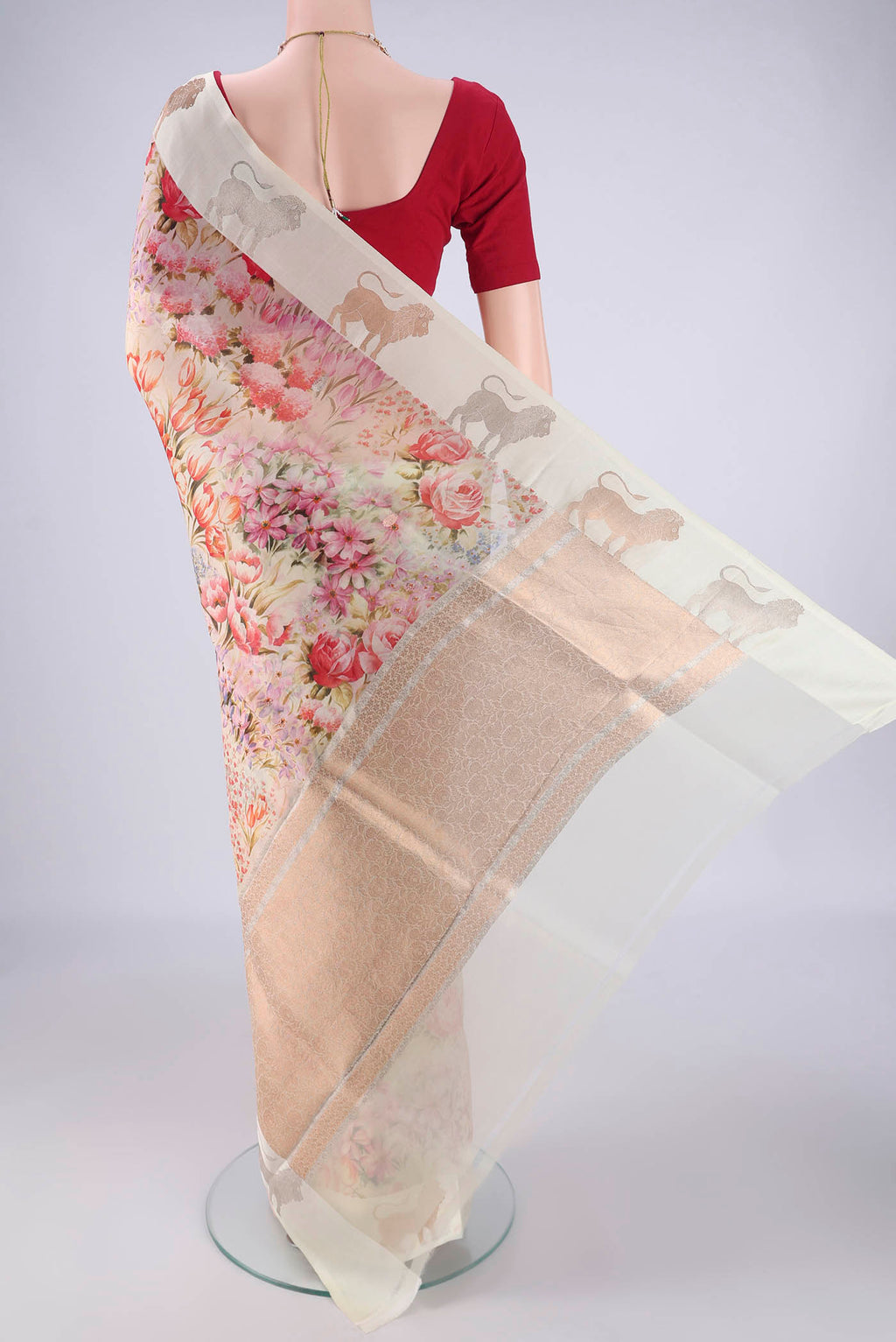 Flat view of Off White Organza Silk Saree with Printed design on the body and Zari Border. 