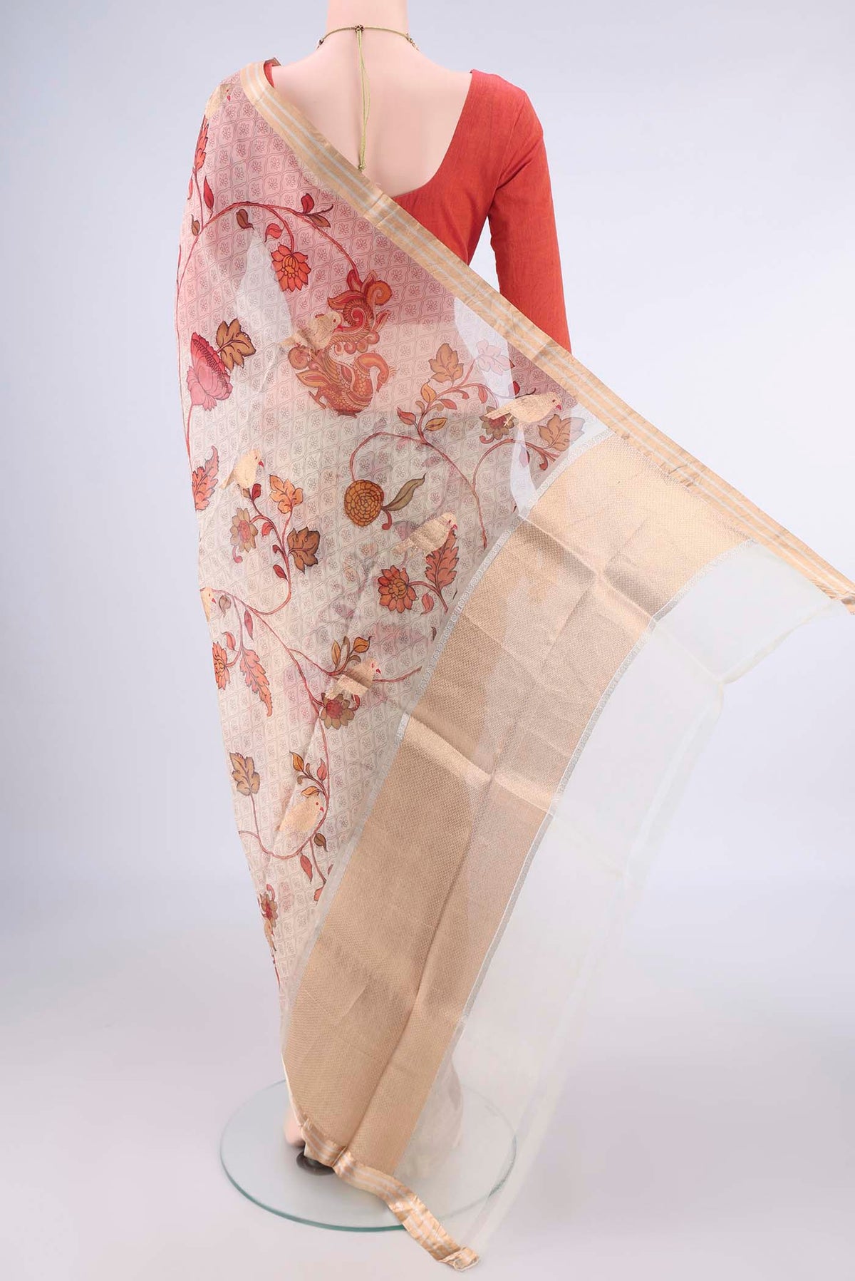 Flat view of Beige Organza Saree with Floral Print on the body and Zari Border. 