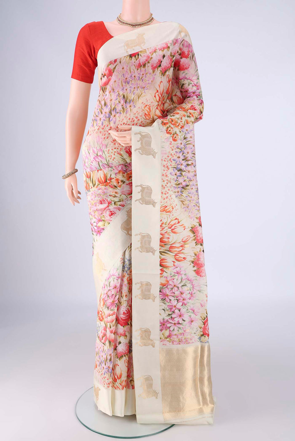 Off White Banarasi Katan Silk Saree with Floral Print on the body and Satin Border.  displayed on a mannequin
