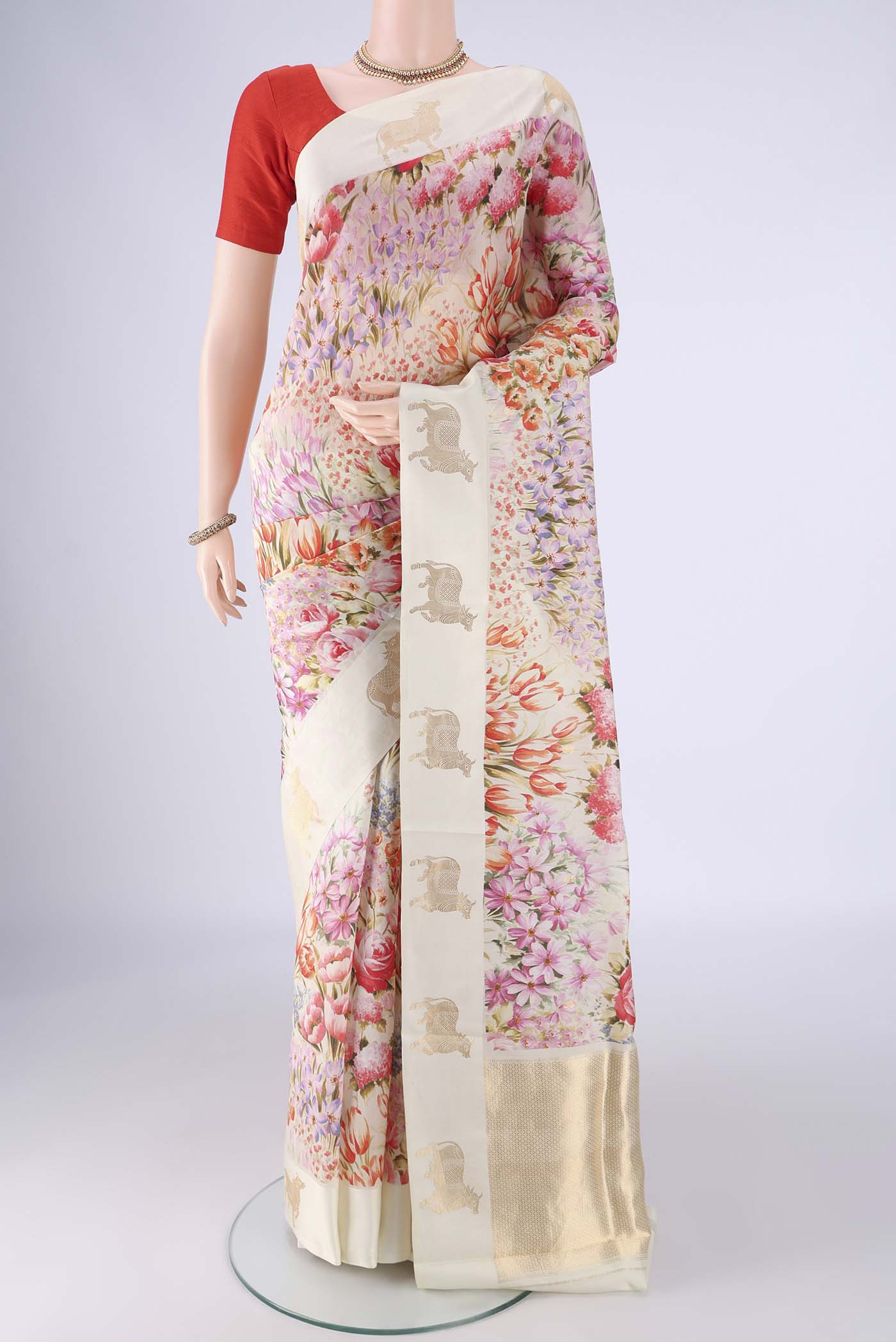 Off White Banarasi Katan Silk Saree with Floral Print on the body and Satin Border.  displayed on a mannequin