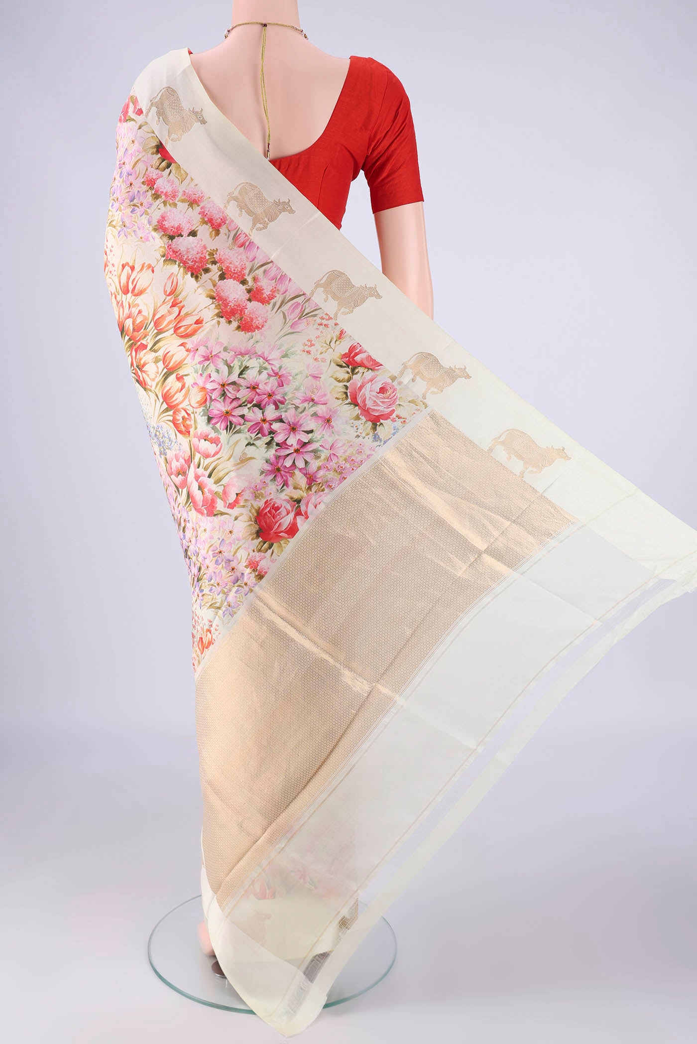 Flat view of Off White Banarasi Katan Silk Saree with Floral Print on the body and Satin Border. 