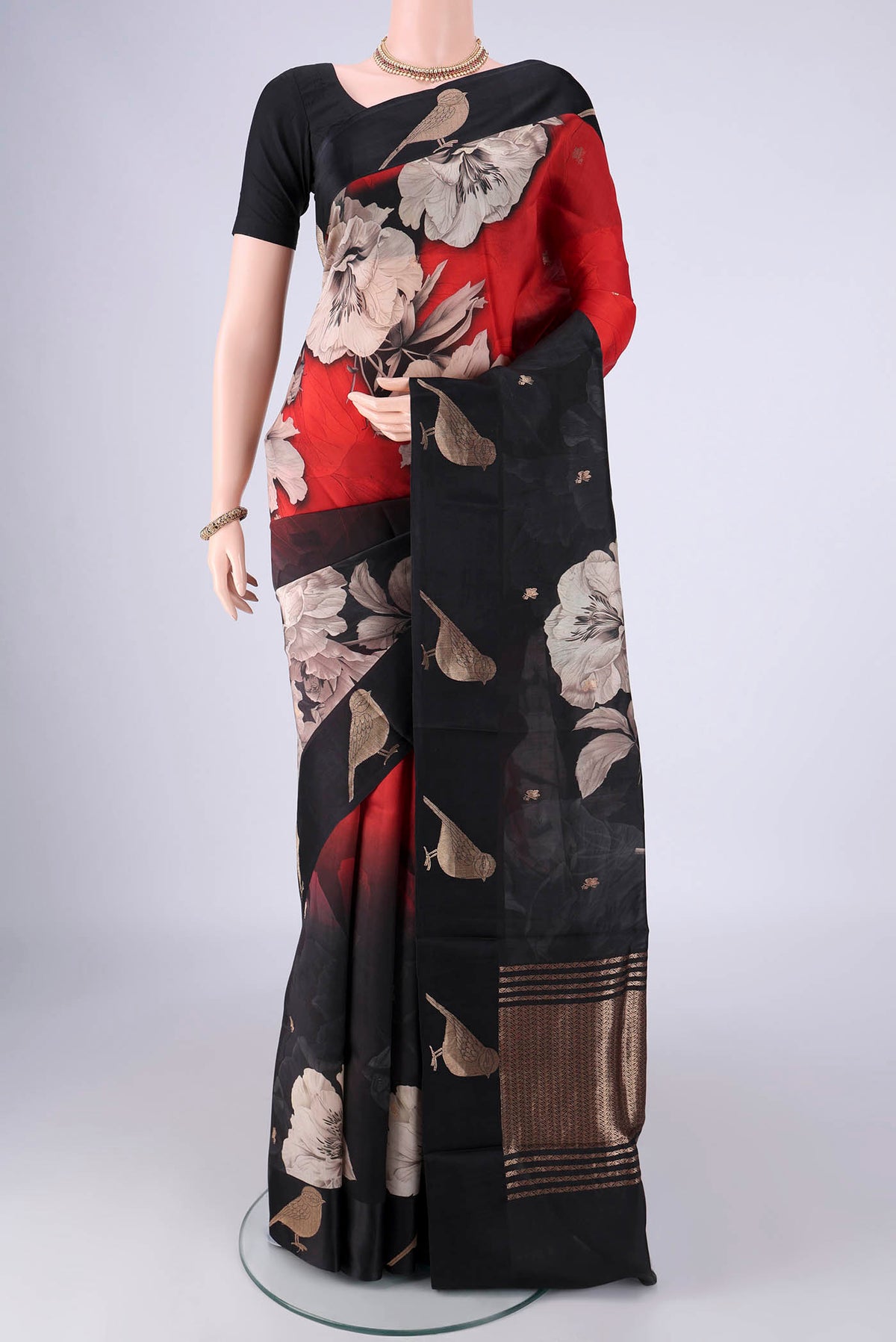 Red Banarasi Katan Silk Saree with Floral Print on the body and Satin Border.  displayed on a mannequin