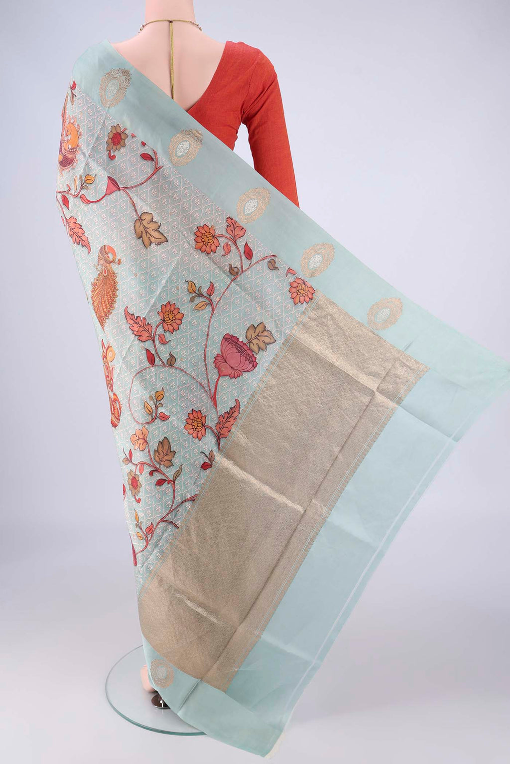 Flat view of Sky Blue Banarasi Katan Silk Saree with Floral Print on the body and Satin Border. 