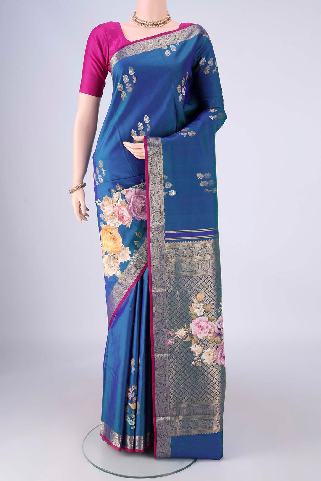 Blue Kanjivaram Silk Saree with Zari Butta on the body and Zari Border.  displayed on a mannequin