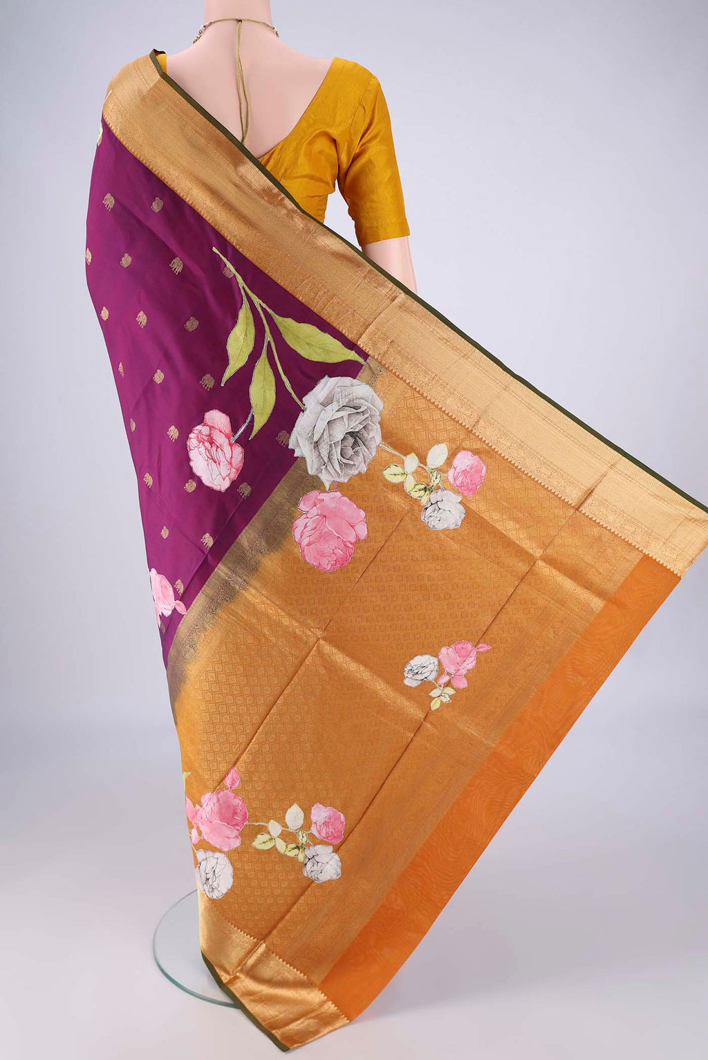 Flat view of Purple Kanjivaram Silk Saree with Zari Butta on the body and Zari Border. 
